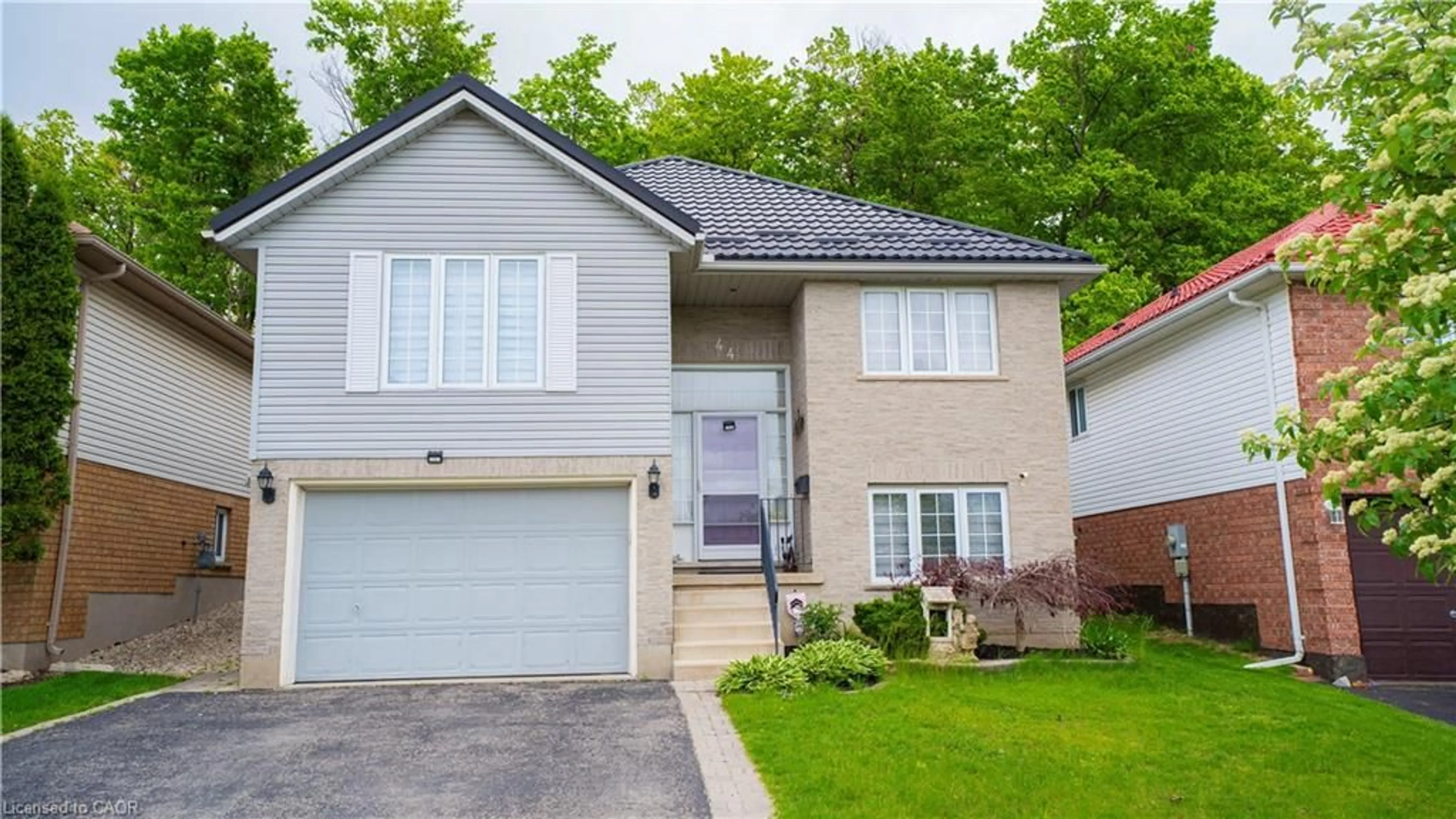 Home with vinyl exterior material, street for 44 Dunnigan Dr, Kitchener Ontario N2B 3W5