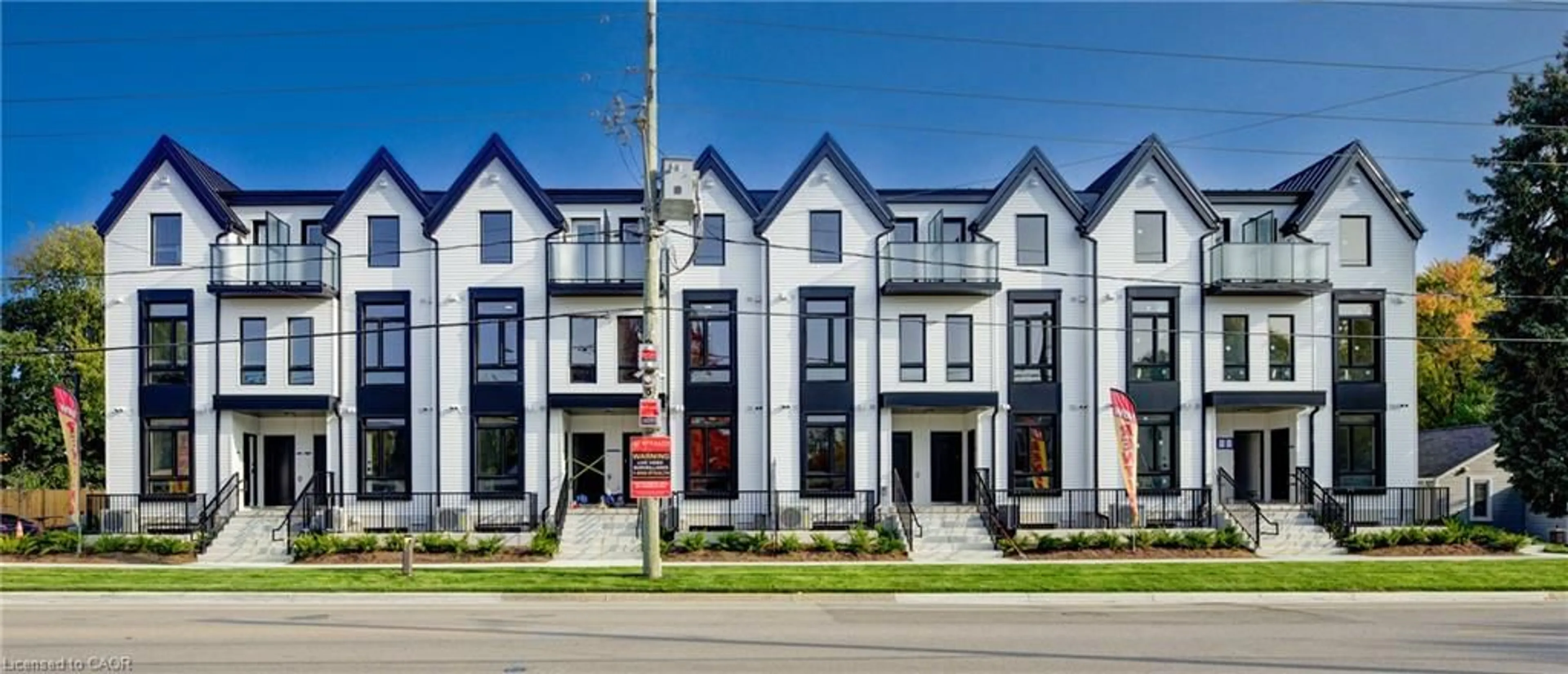 Home with brick exterior material, street for 132 Woolwich St #104, Kitchener Ontario N2K 0H9