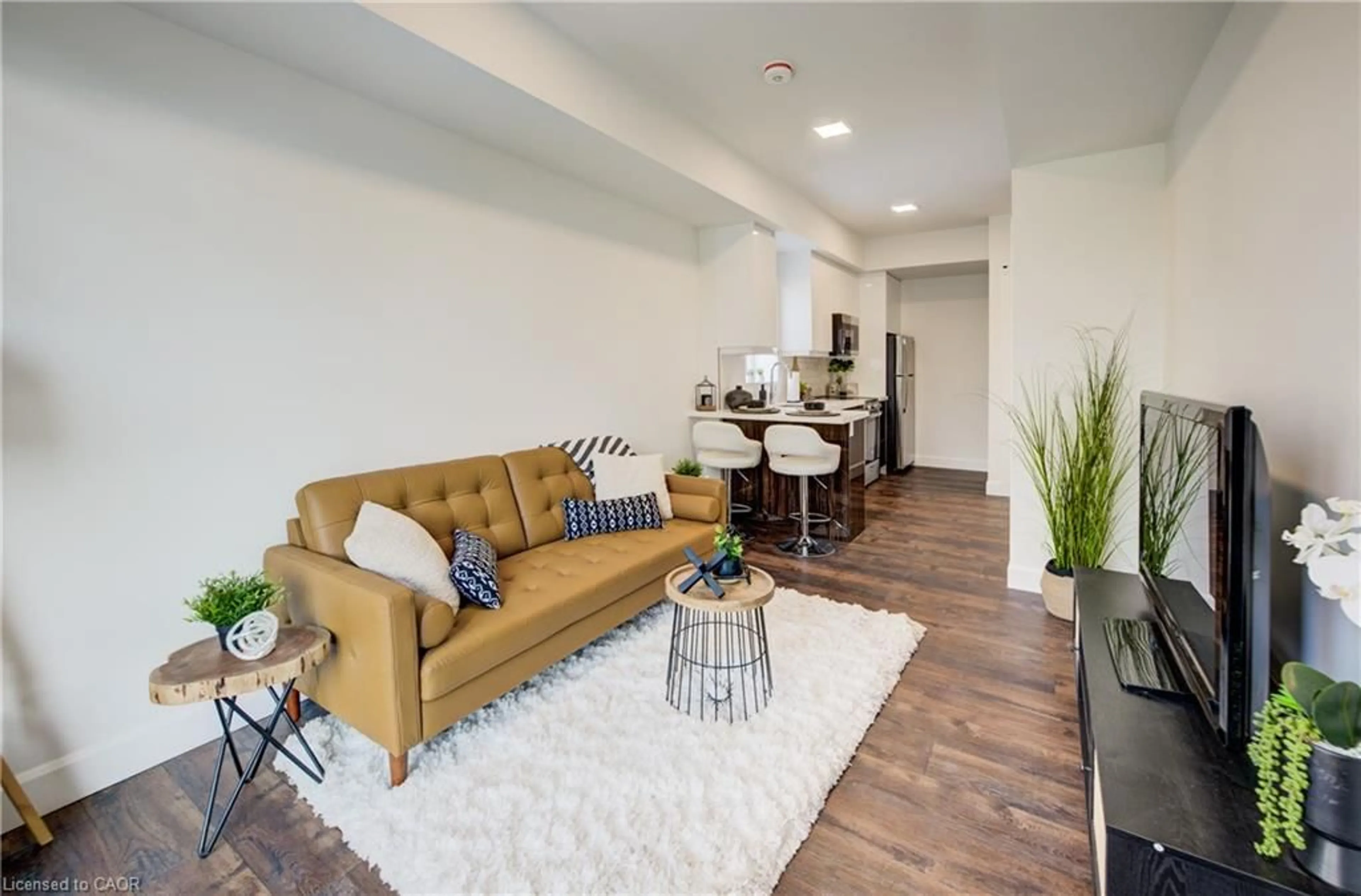 Living room with furniture, unknown for 132 Woolwich St #104, Kitchener Ontario N2K 0H9