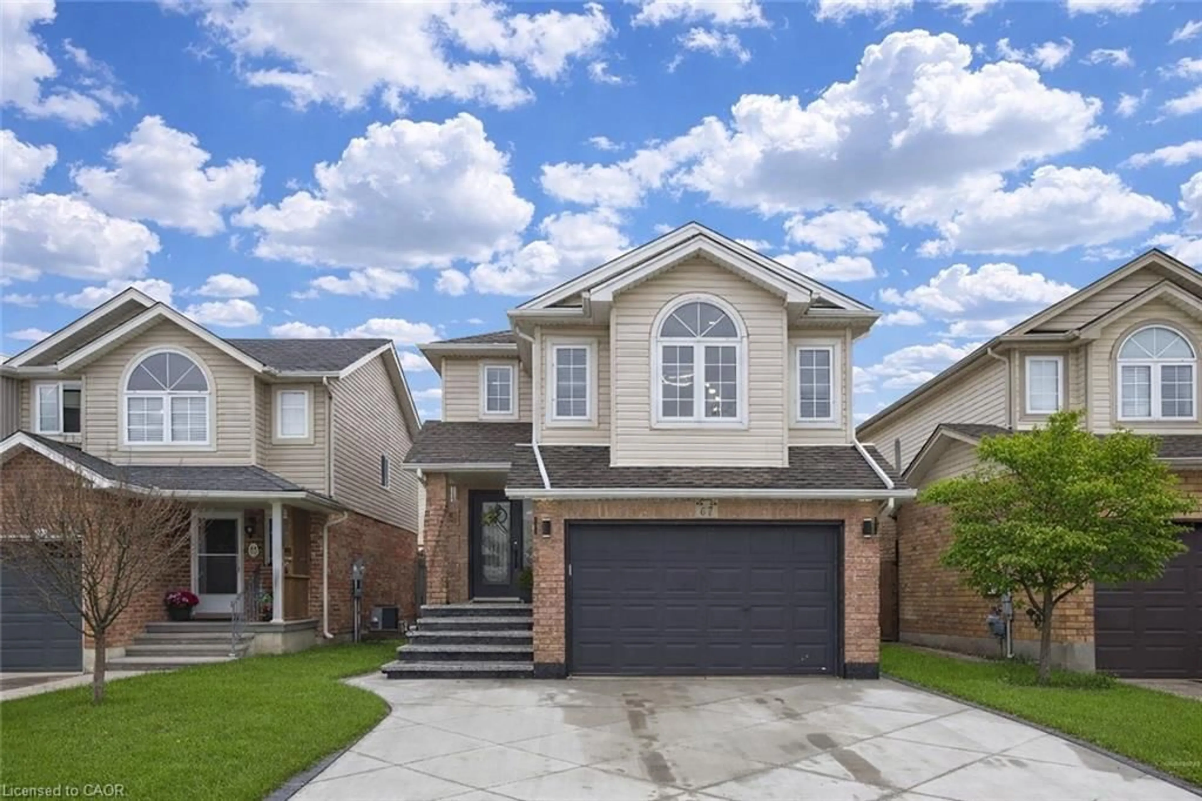 Home with vinyl exterior material, street for 67 Bridlewreath St, Kitchener Ontario N2E 3V5
