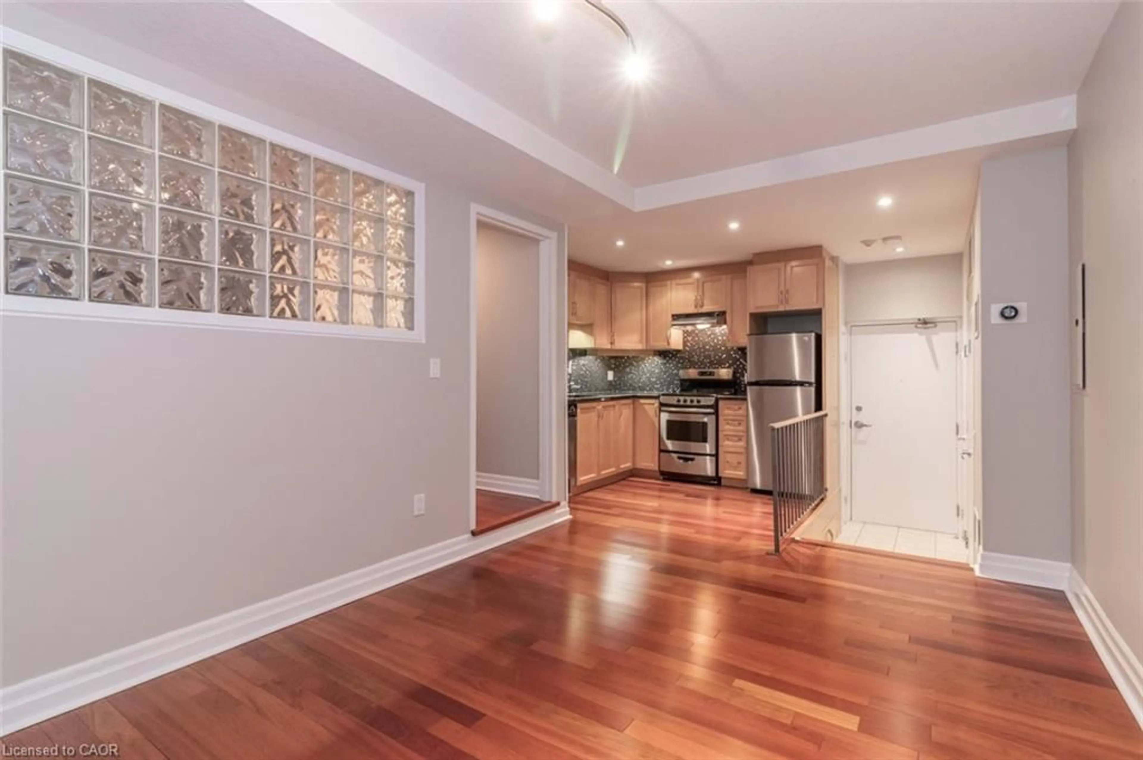 Open concept kitchen, wood/laminate floor for 35 Alexandra Ave #103, Waterloo Ontario N2L 1L4