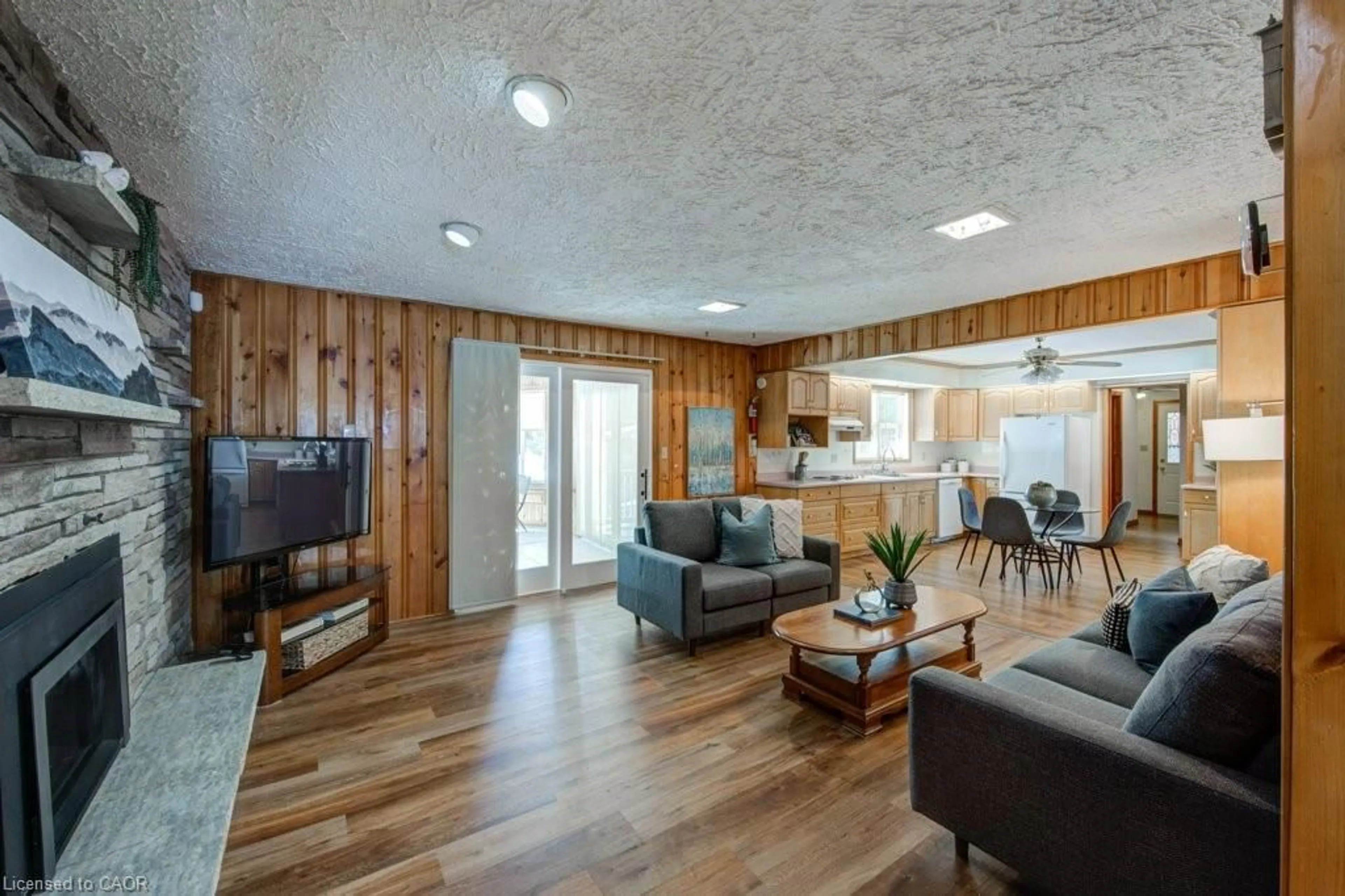 Living room with furniture, wood/laminate floor for 6691 Perth Line 44, Bornholm Ontario N0K 1A0