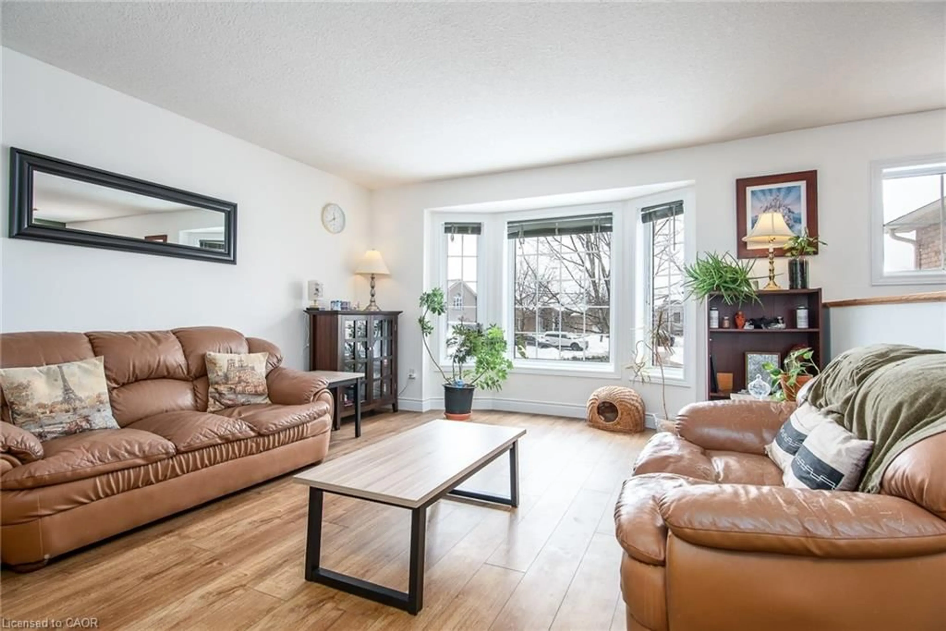 Living room with furniture, wood/laminate floor for 8 Berdux Pl, Wellesley Ontario N0B 2T0