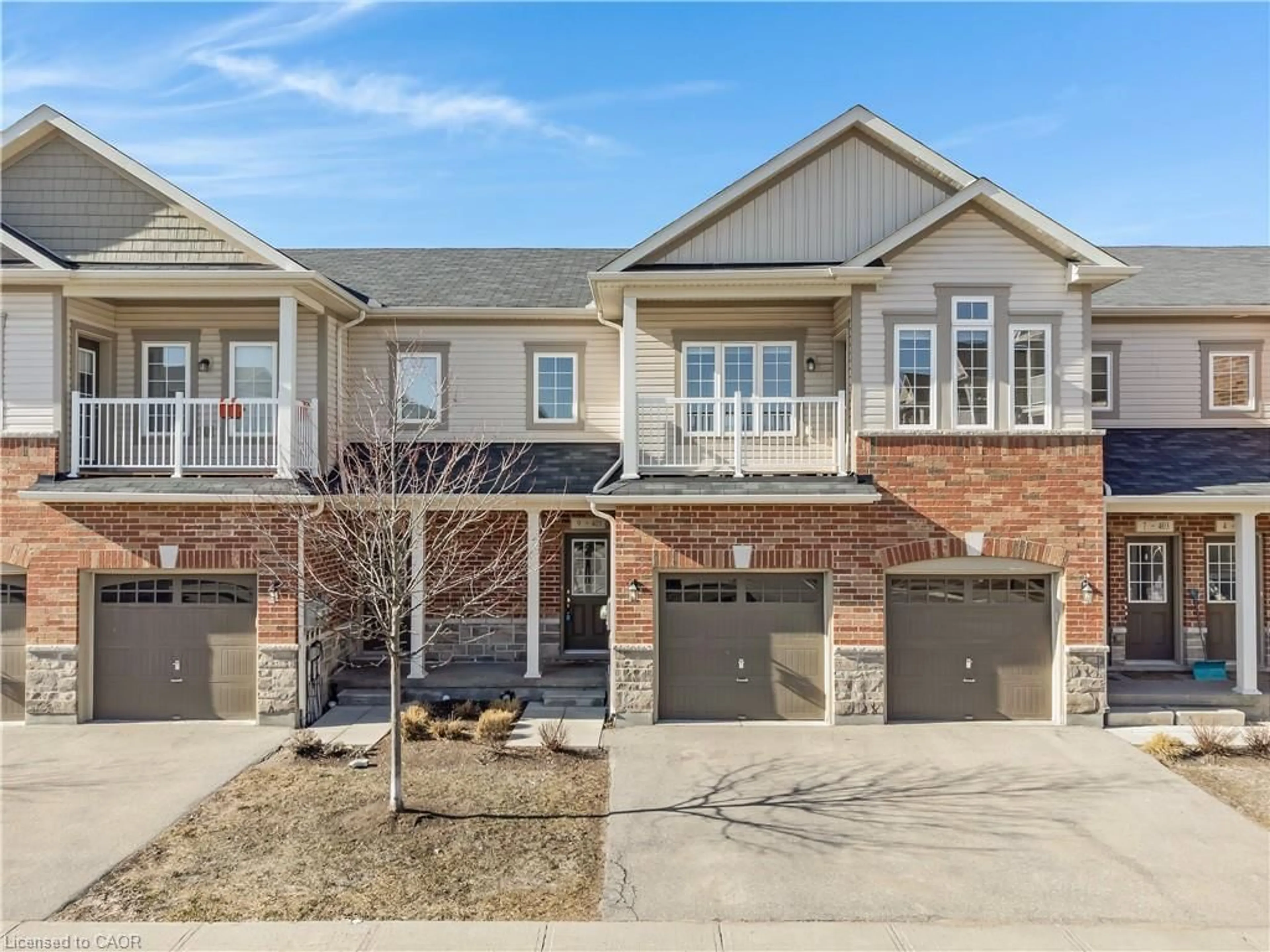 Home with brick exterior material, street for 403 Westwood Dr #9, Kitchener Ontario N2M 0B5