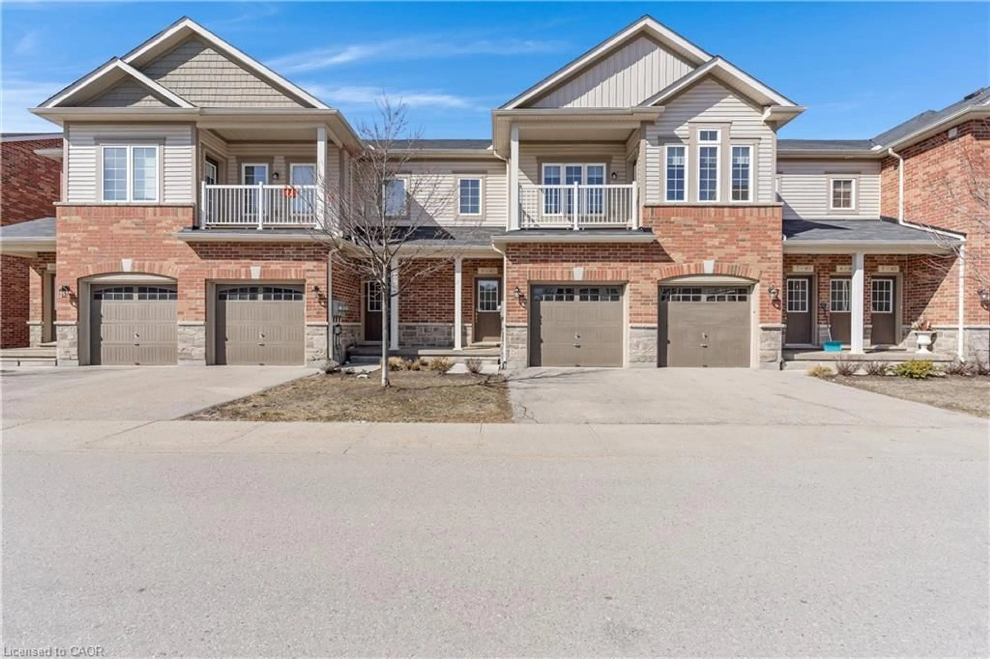 Home with brick exterior material, street for 403 Westwood Dr #9, Kitchener Ontario N2M 0B5