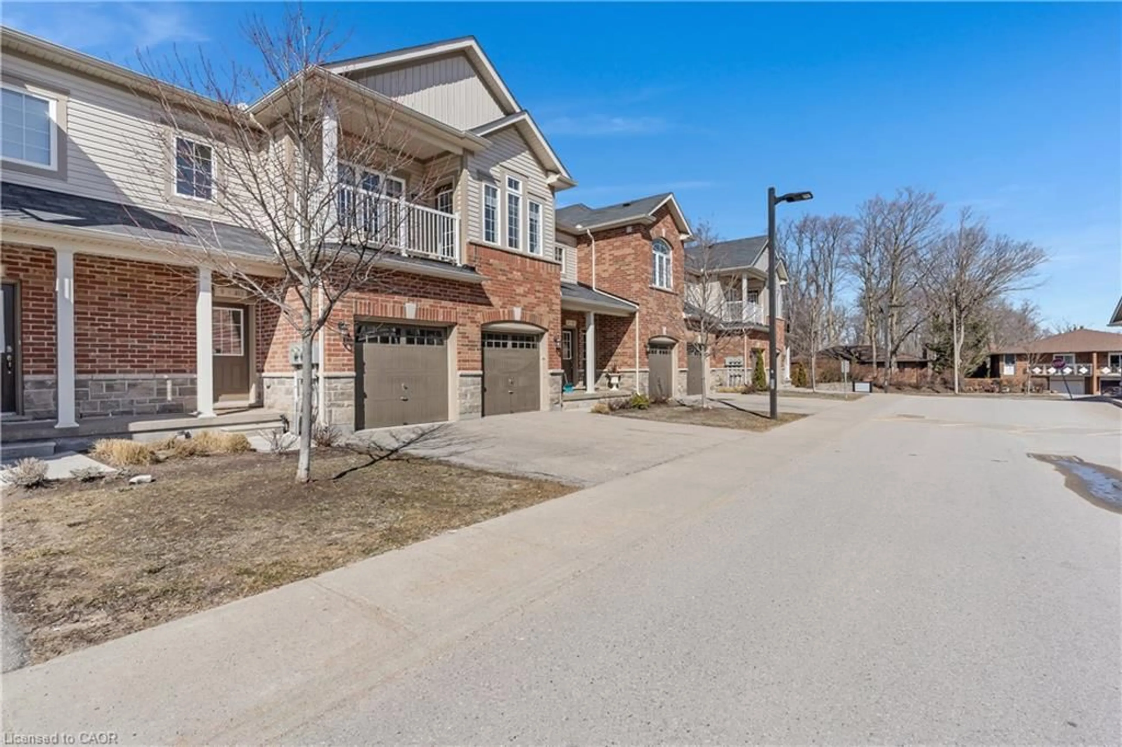 Home with brick exterior material, street for 403 Westwood Dr #9, Kitchener Ontario N2M 0B5
