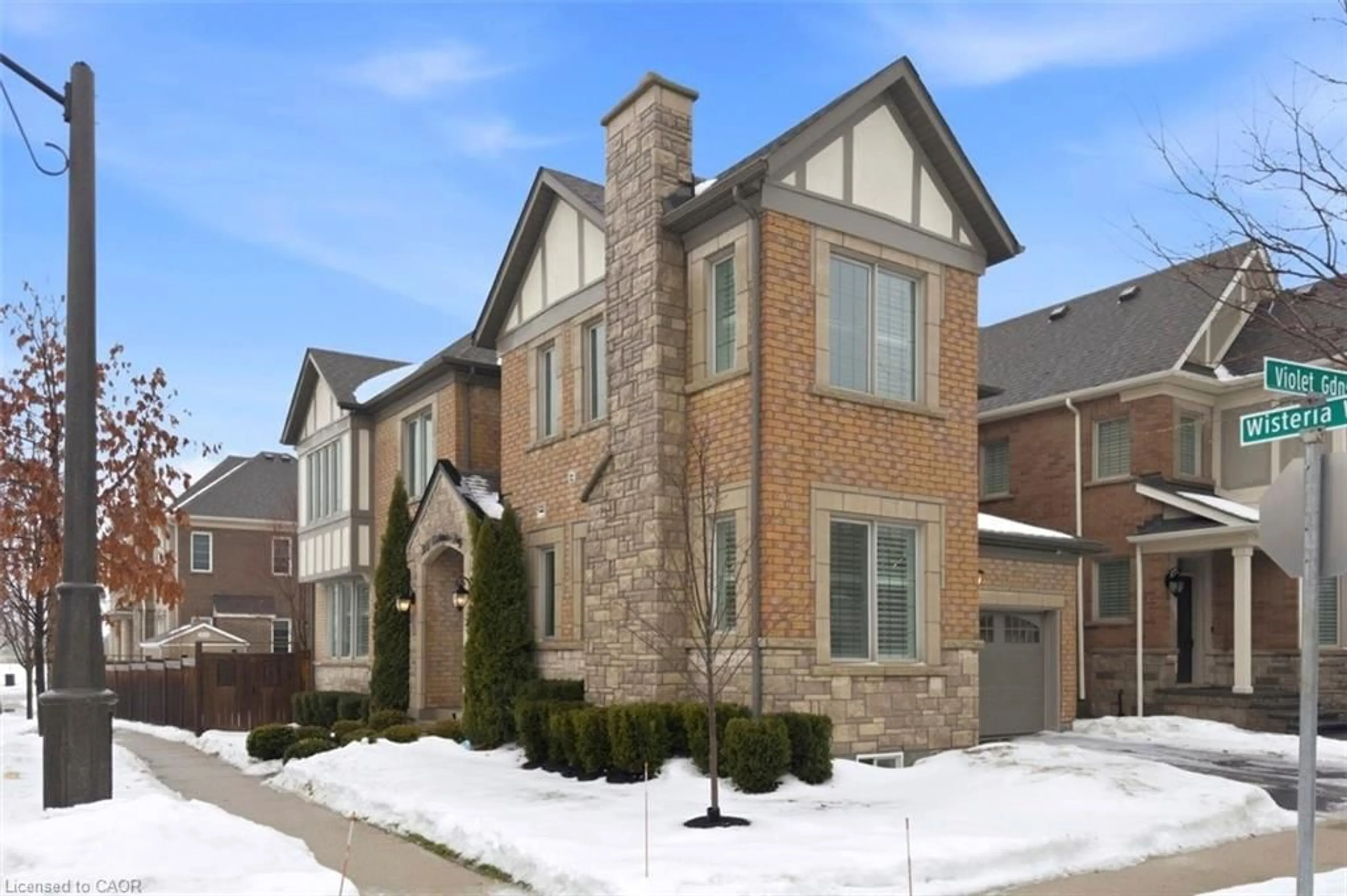 Home with brick exterior material, street for 355 Wisteria Way, Oakville Ontario L6M 1L6