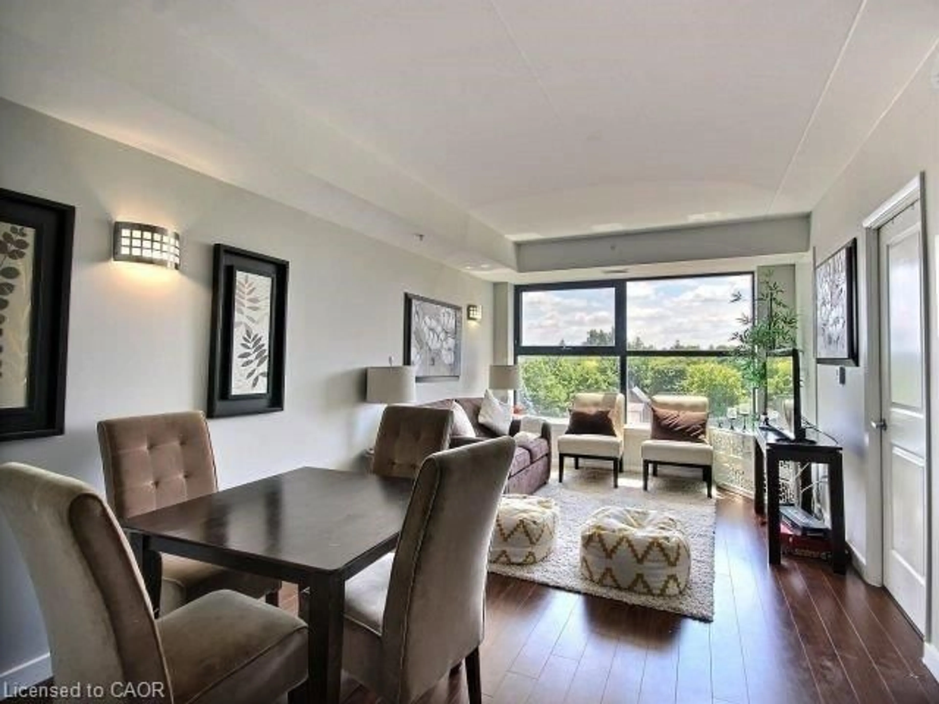 Living room with furniture, wood/laminate floor for 1291 Gordon St #425, Guelph Ontario N1L 0M5