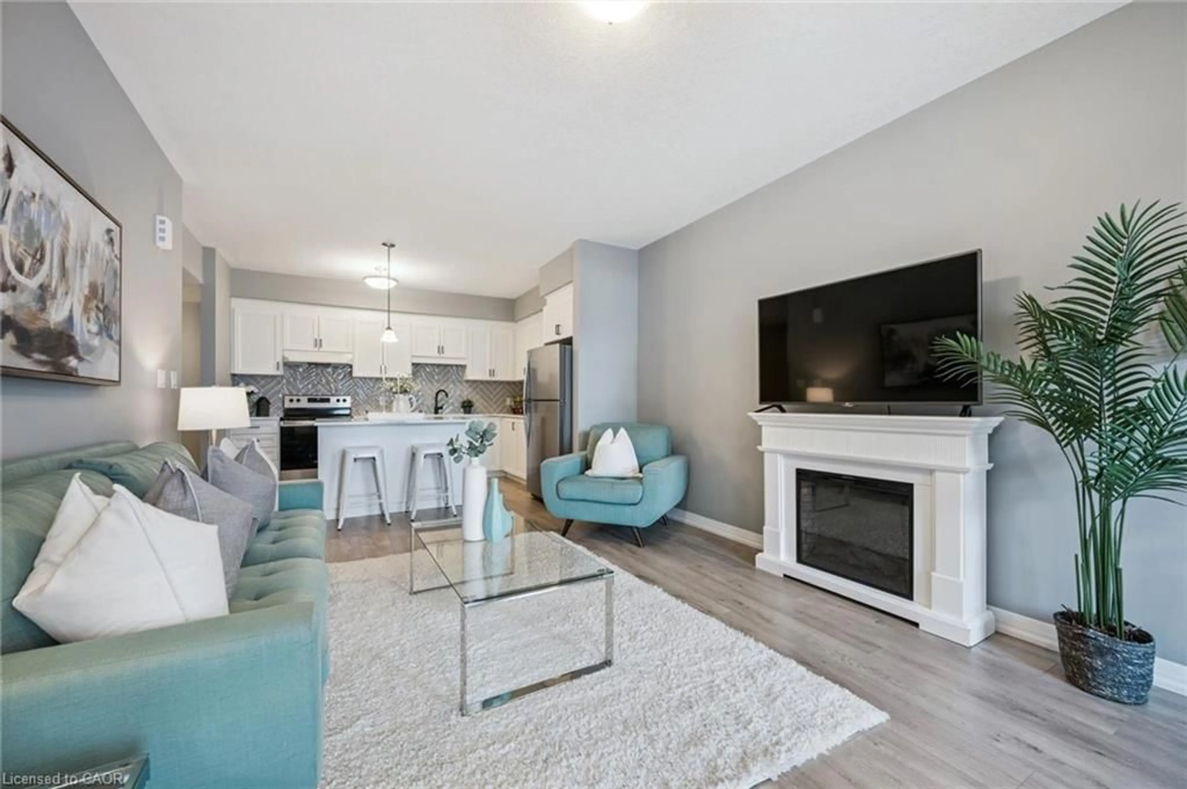 Living room with furniture, wood/laminate floor for 261 Woodbine Ave #35, Kitchener Ontario N2R 0S7