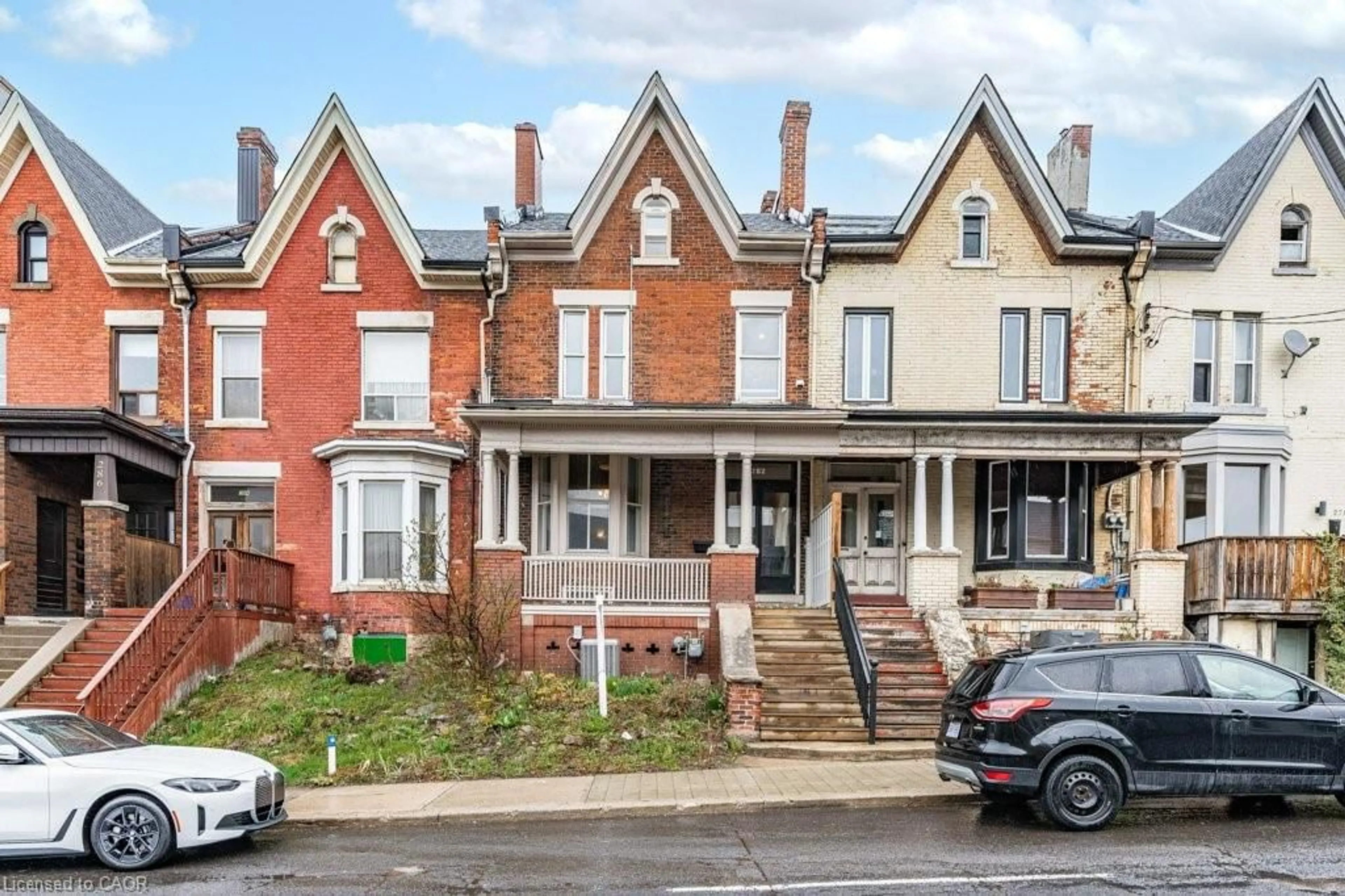 Home with brick exterior material, street for 282 Main St, Hamilton Ontario L8P 1J8