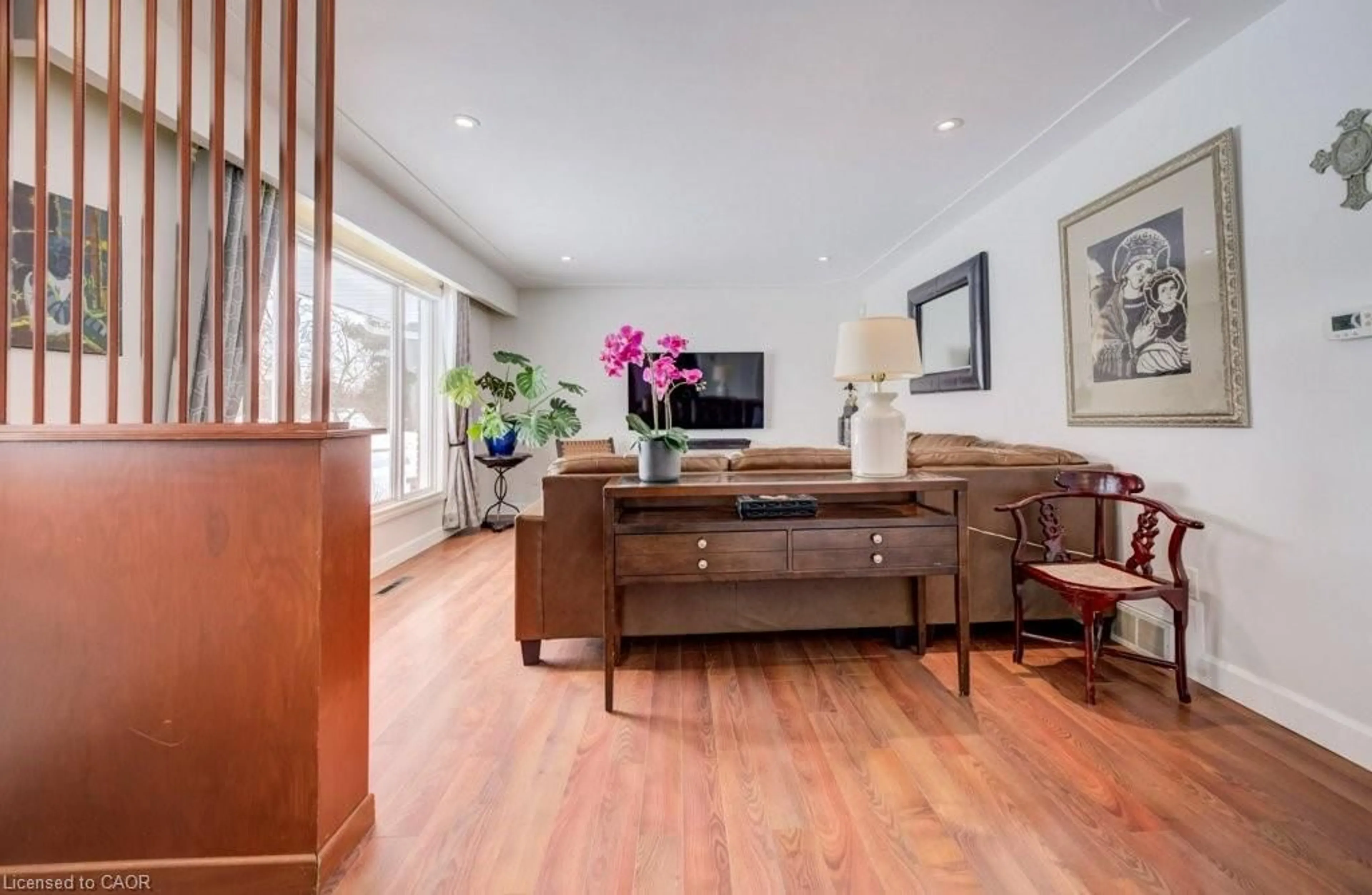 Living room with furniture, wood/laminate floor for 185 Miller St, Mount Forest Ontario N0G 2L3