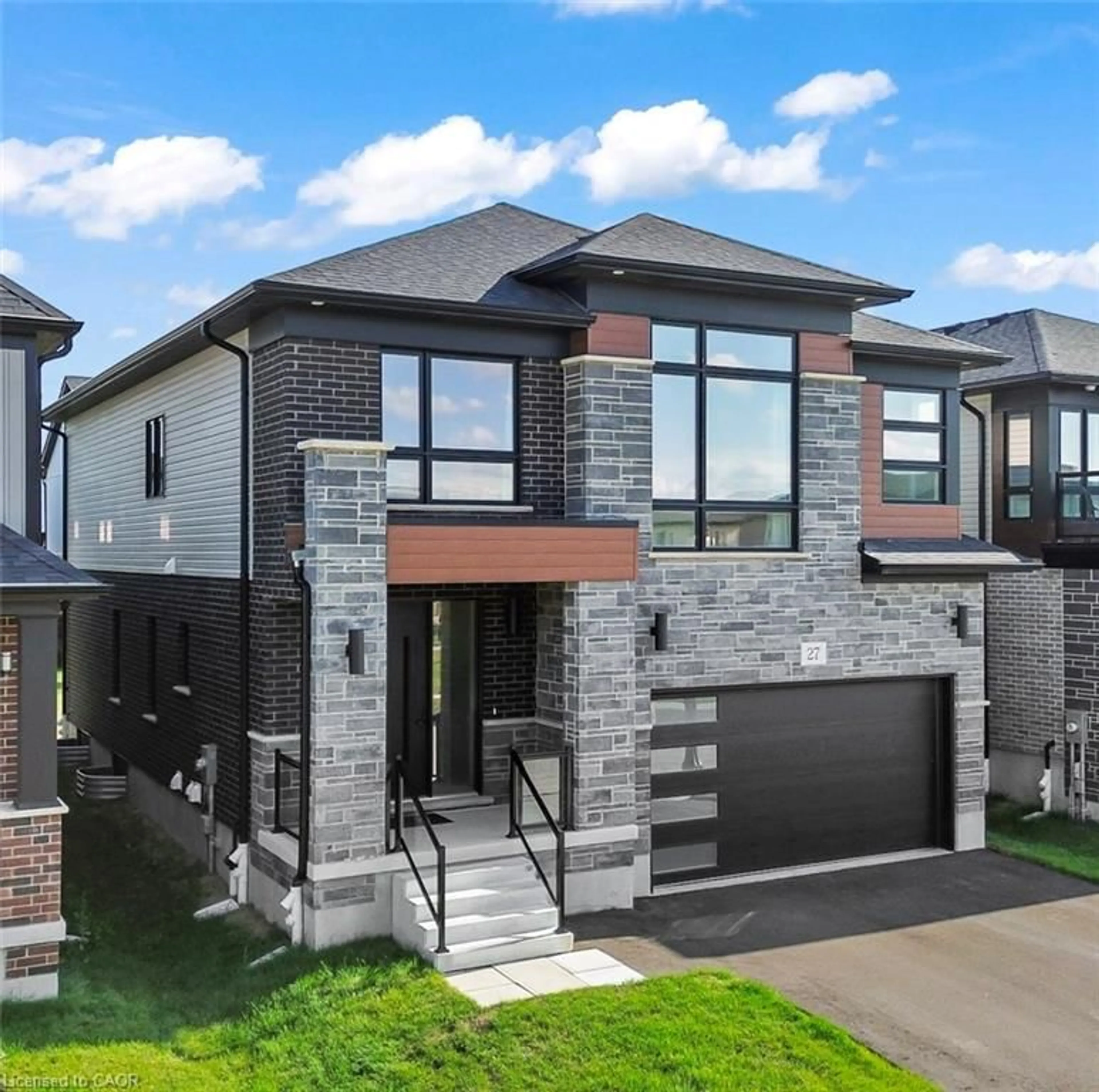 Home with brick exterior material, street for 27 Jacob Detweiller Dr, Kitchener Ontario N2P 0K7
