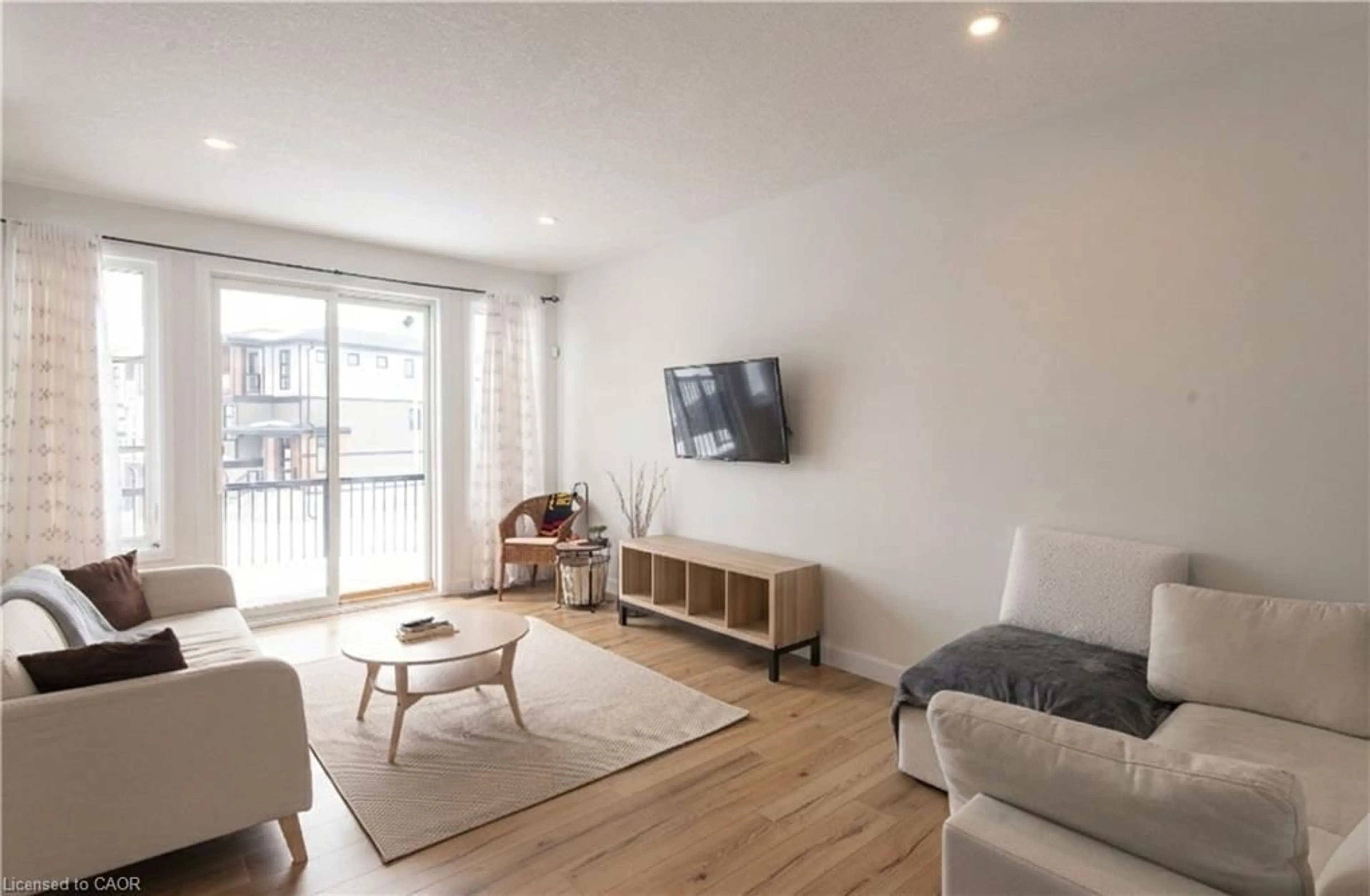 Living room with furniture, wood/laminate floor for 143 Superior Dr, Amherstview Ontario K7N 1E5