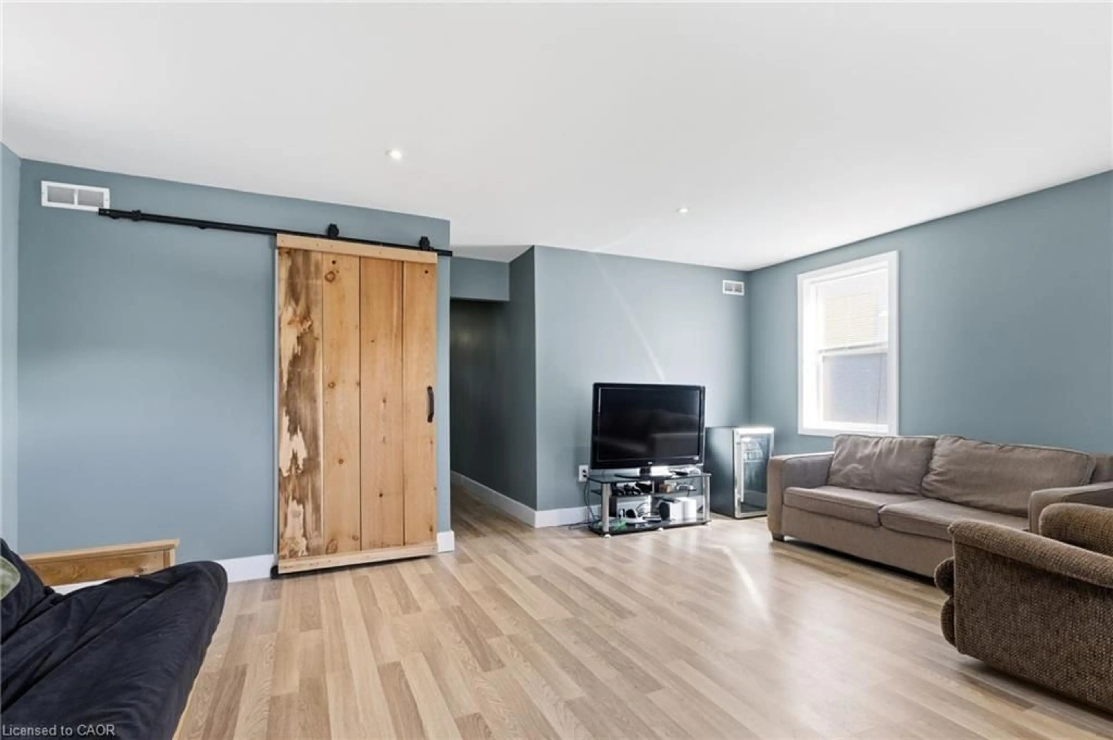 Living room with furniture, wood/laminate floor for 194 Townline St, St. Williams Ontario N0E 1P0