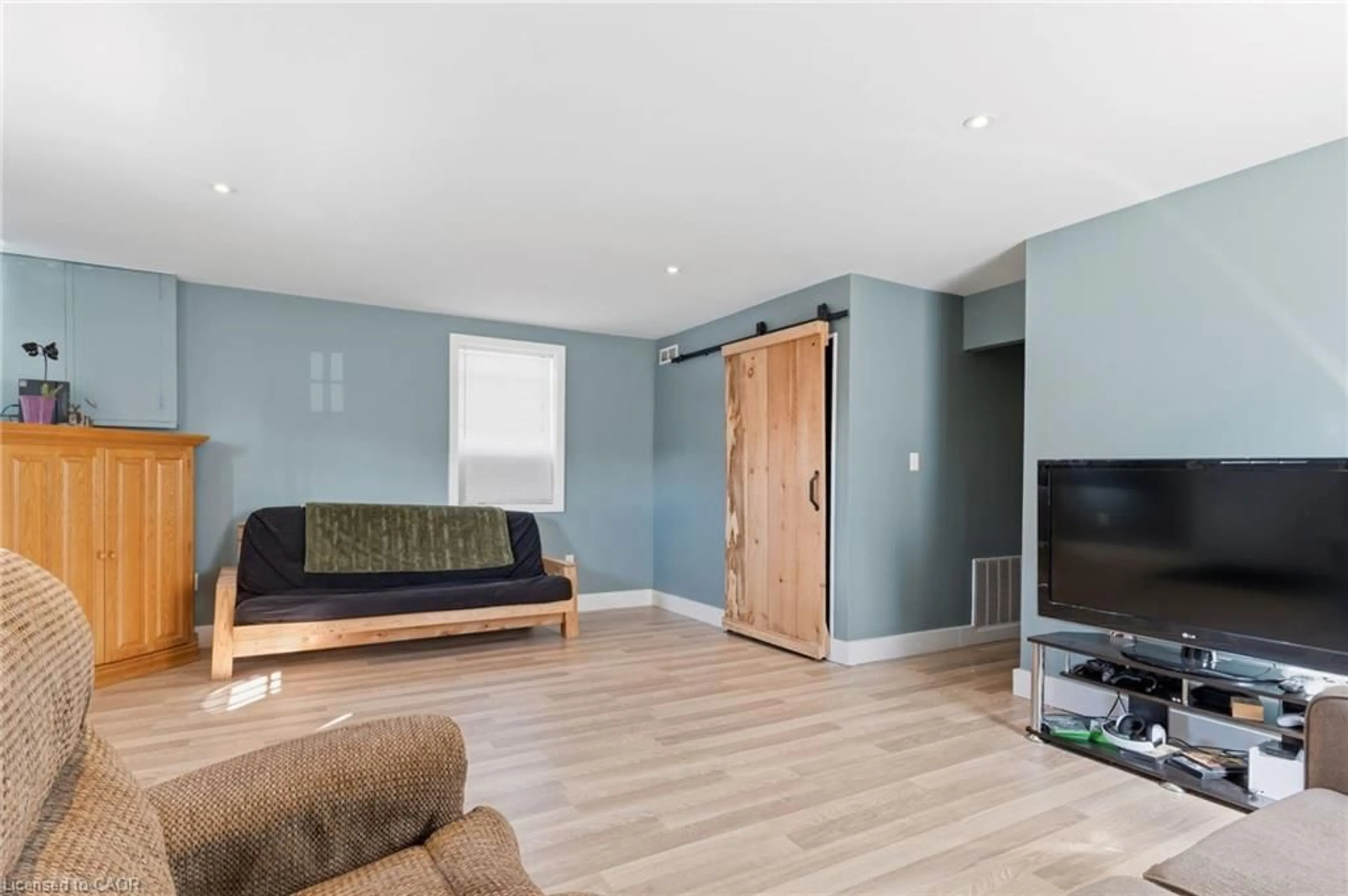 Living room with furniture, wood/laminate floor for 194 Townline St, St. Williams Ontario N0E 1P0