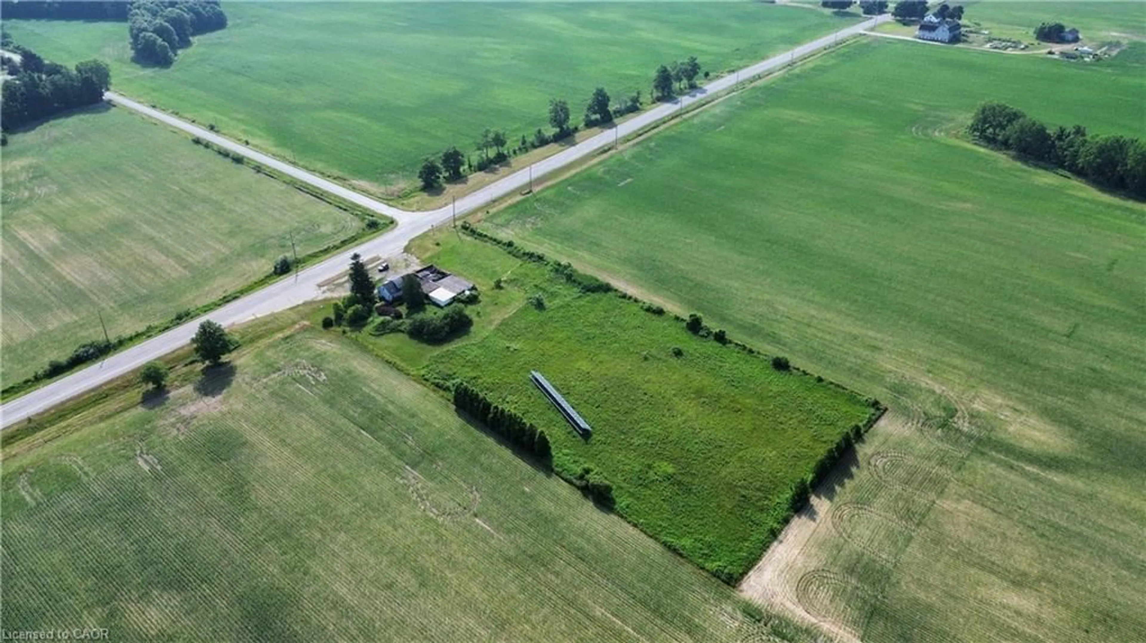 A pic from outside/outdoor area/front of a property/back of a property/a pic from drone, street for 2995 Highway 59, Walsingham Ontario N0E 1G0