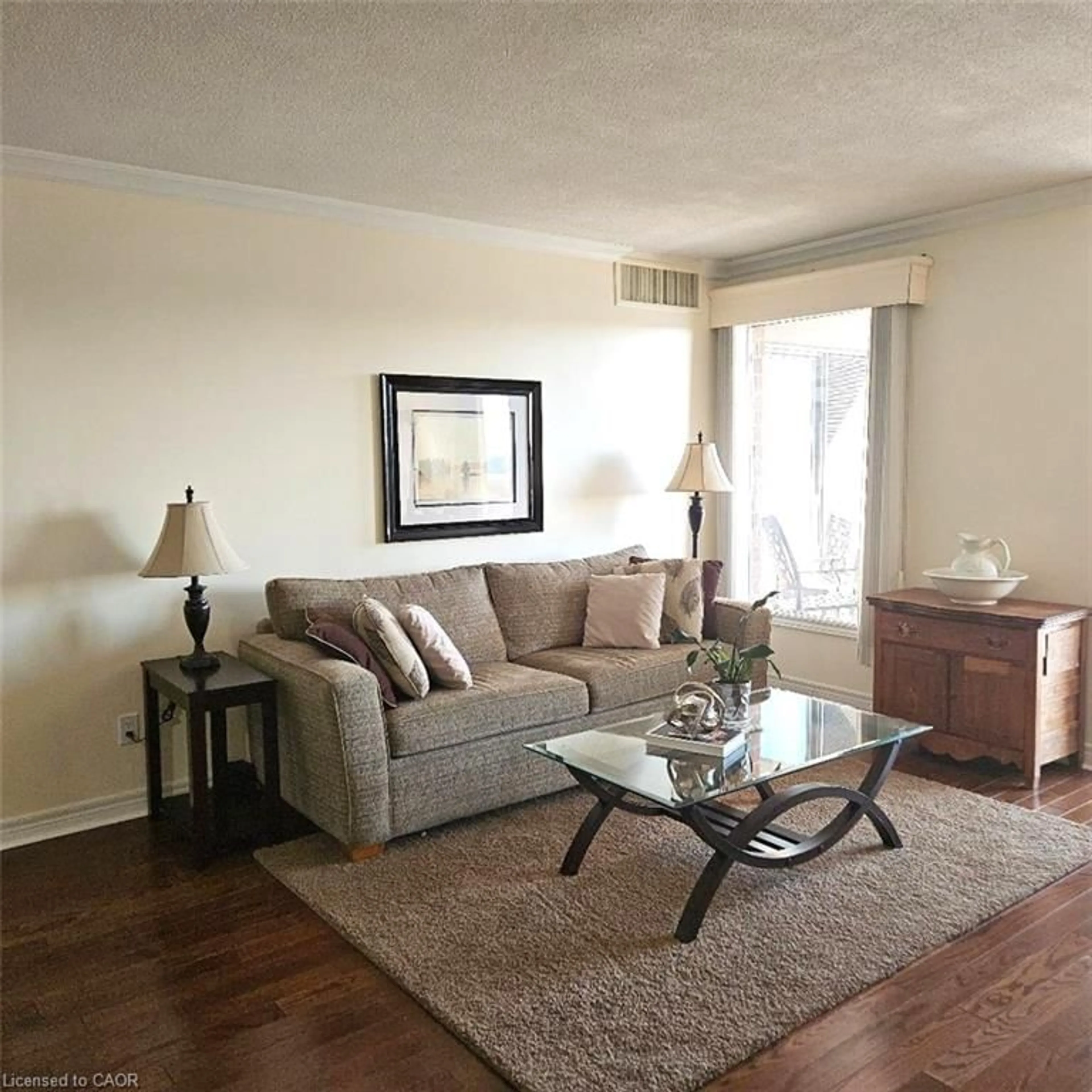 Living room with furniture, wood/laminate floor for 260 Sheldon Ave #609, Kitchener Ontario N2H 6P2