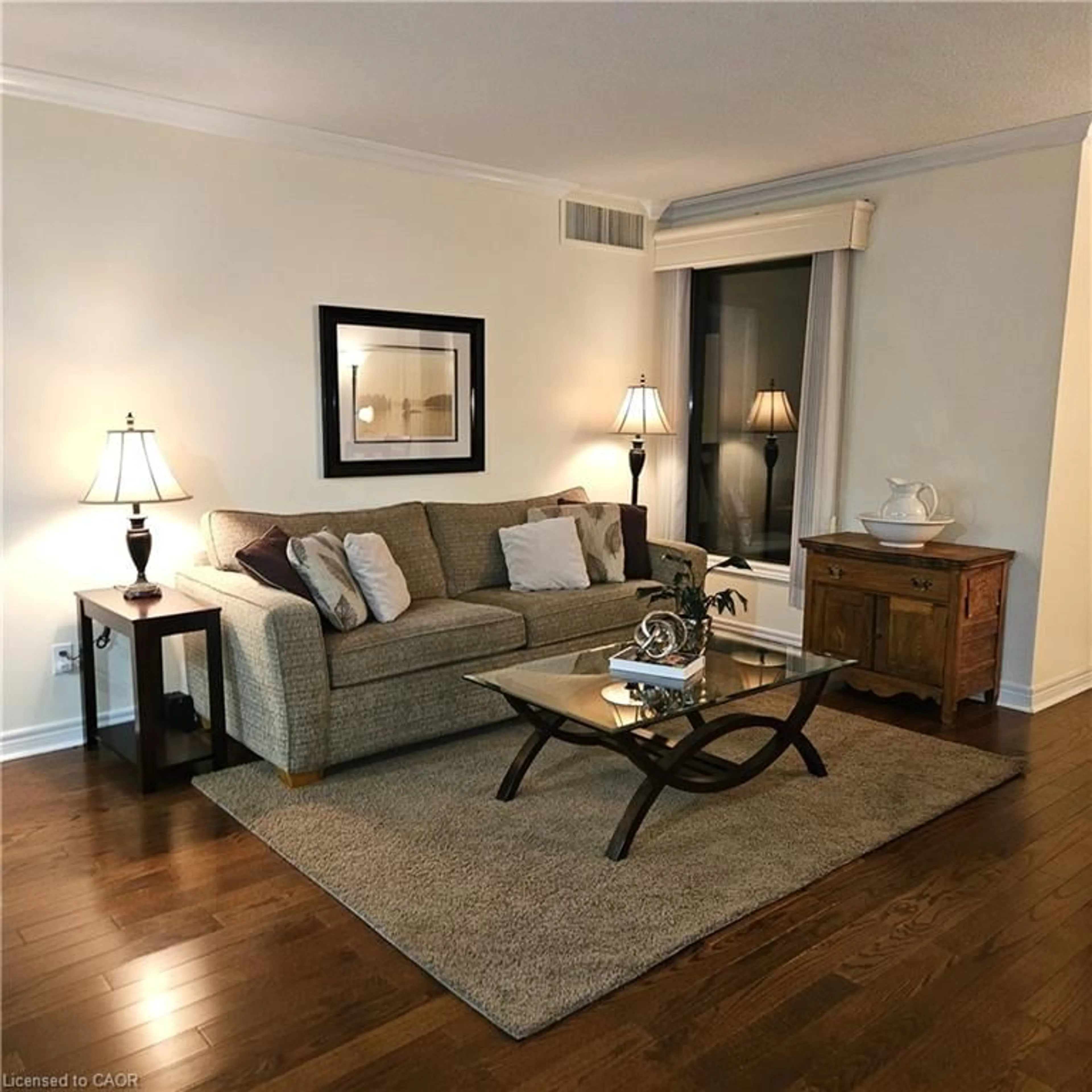 Living room with furniture, wood/laminate floor for 260 Sheldon Ave #609, Kitchener Ontario N2H 6P2