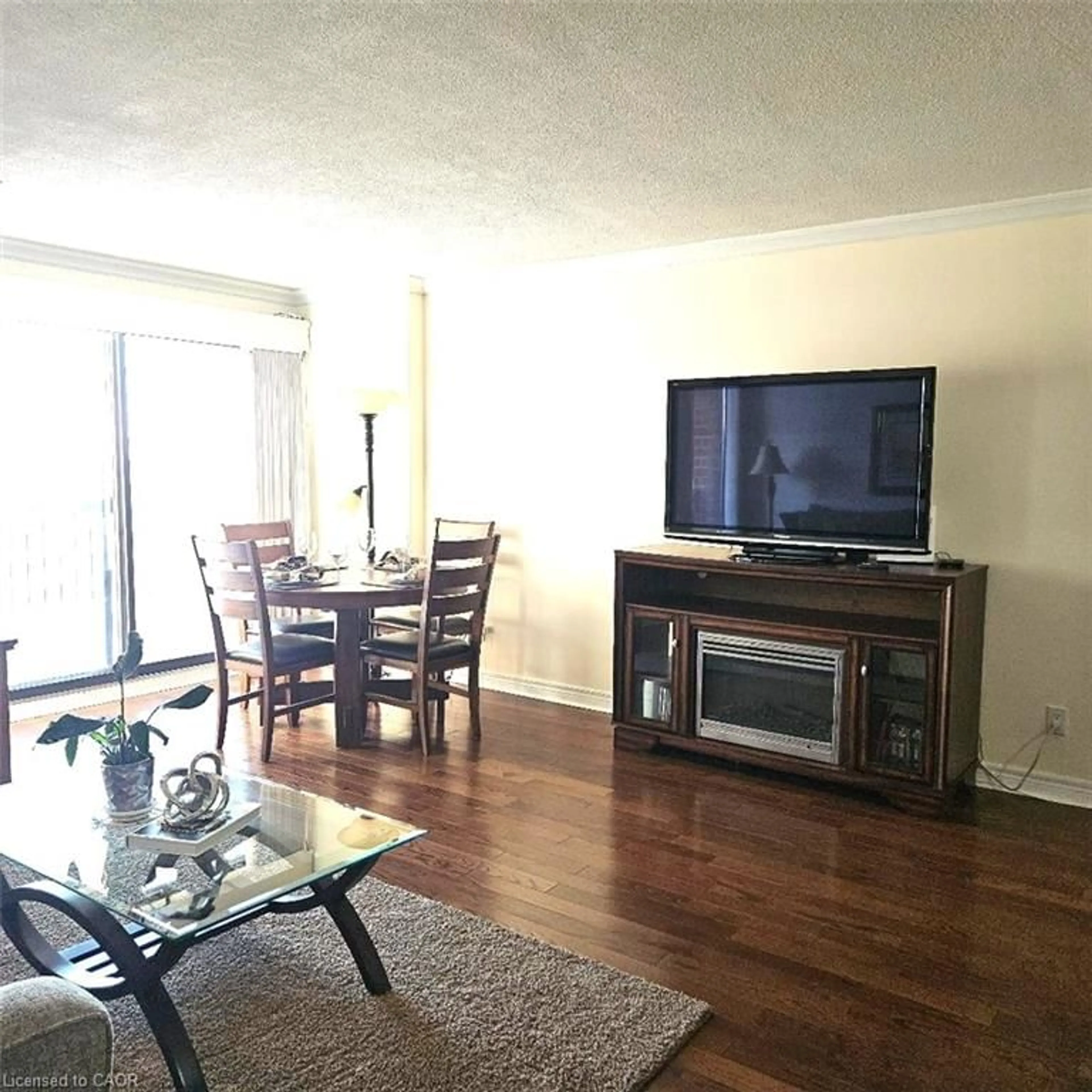 Living room with furniture, wood/laminate floor for 260 Sheldon Ave #609, Kitchener Ontario N2H 6P2