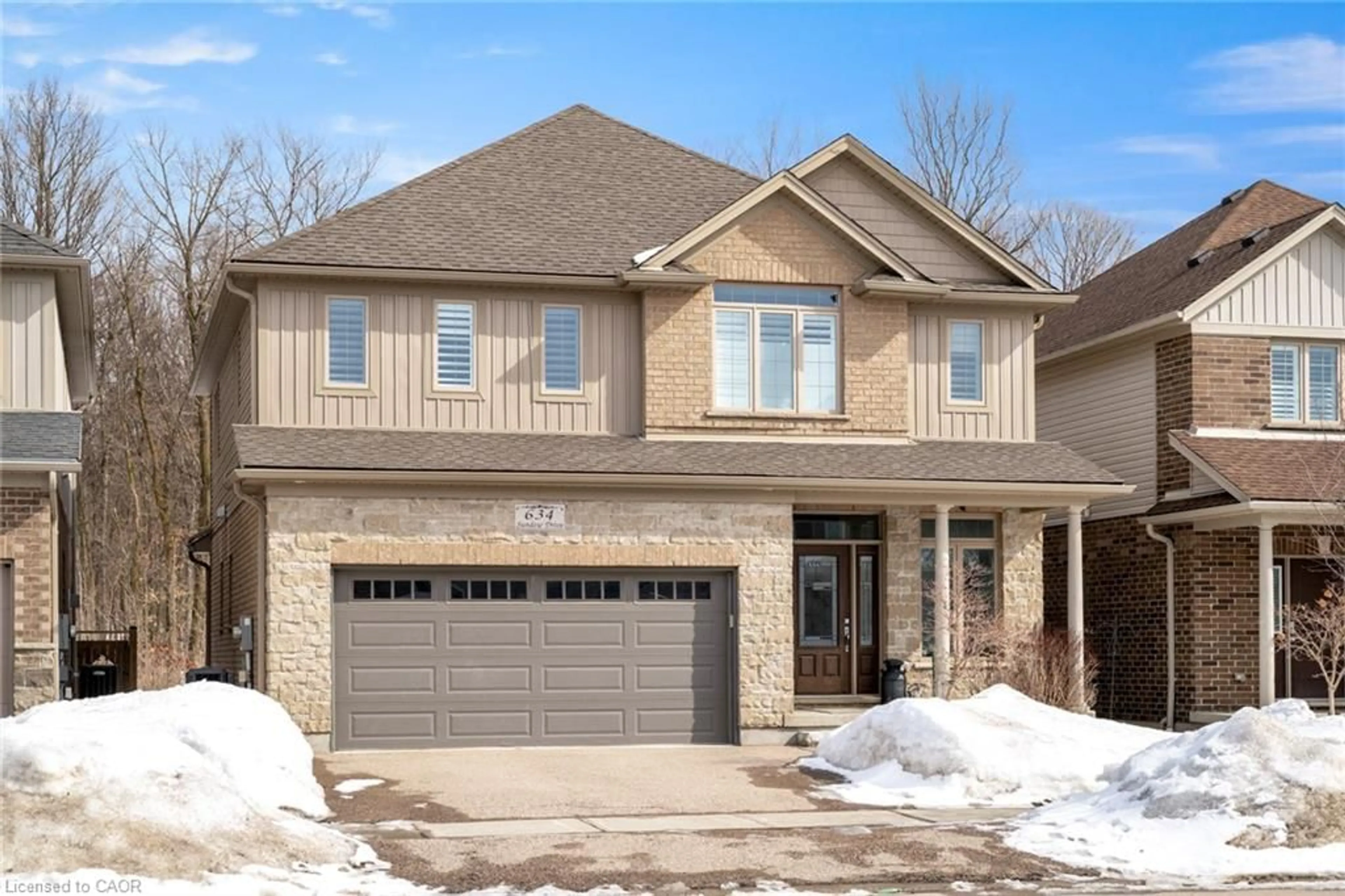 Home with brick exterior material, street for 634 Sundew Dr, Waterloo Ontario N2V 0C1