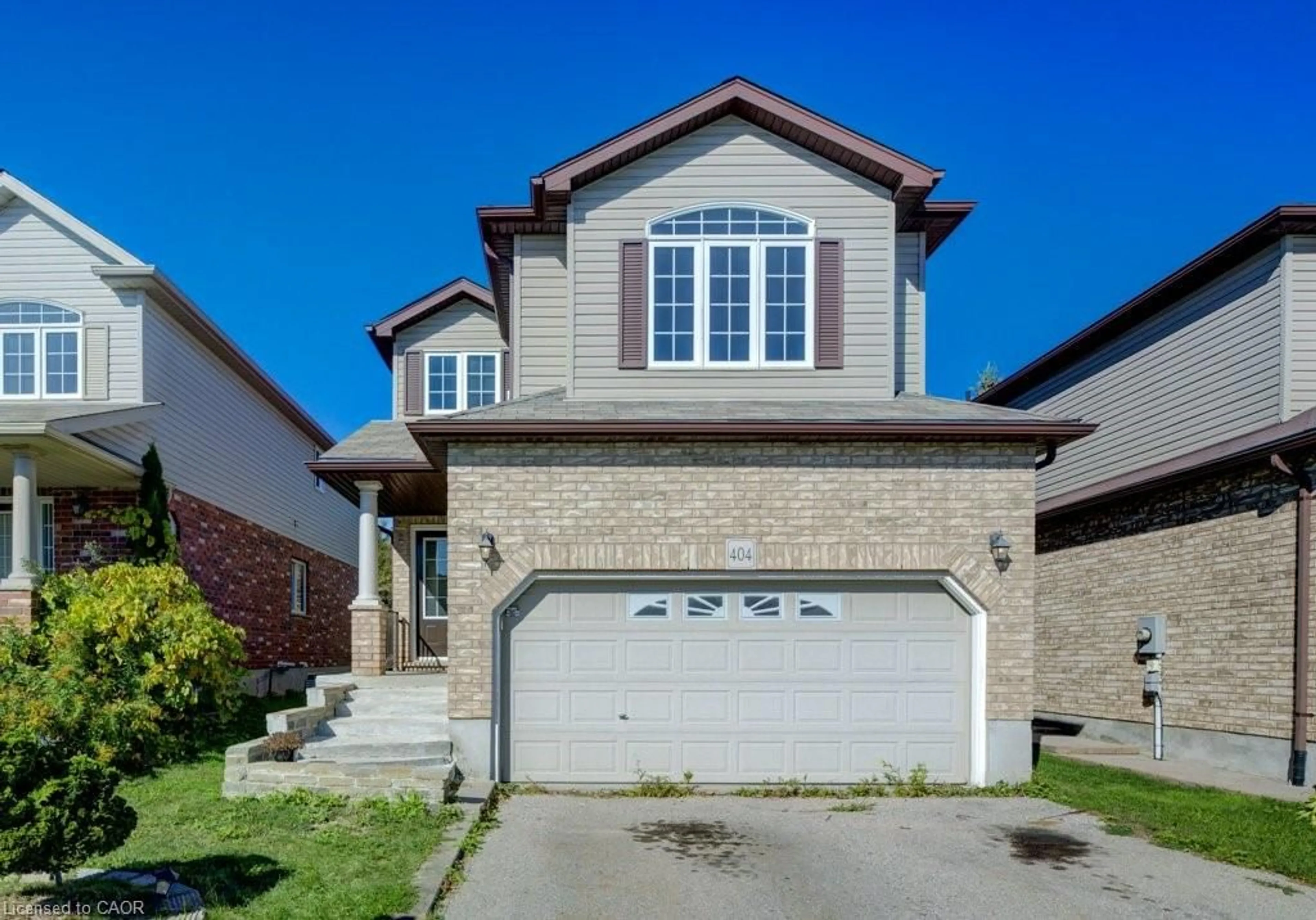 Home with brick exterior material, street for 404 Tealby Cres, Waterloo Ontario N2J 4Y8