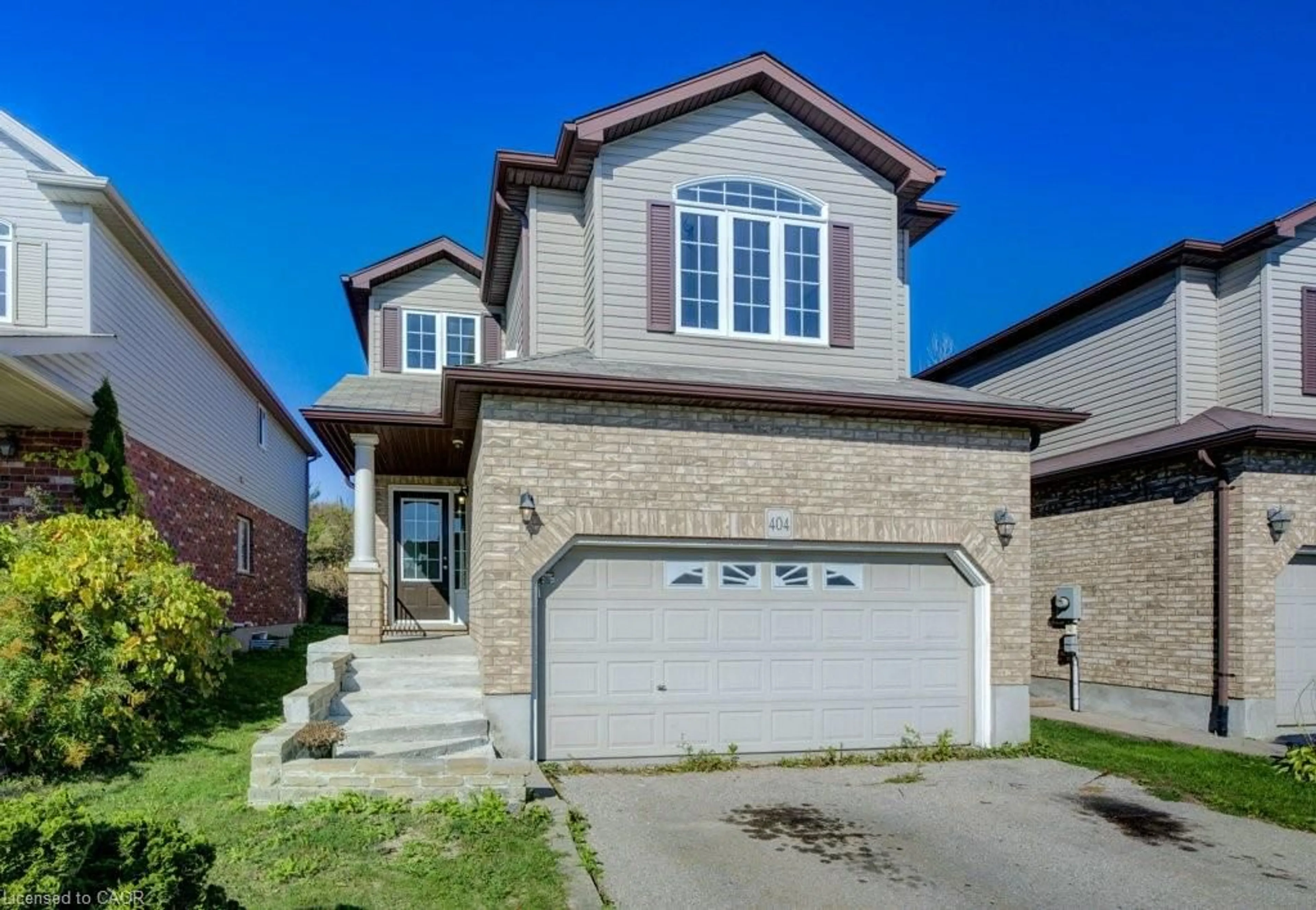 Home with brick exterior material, street for 404 Tealby Cres, Waterloo Ontario N2J 4Y8