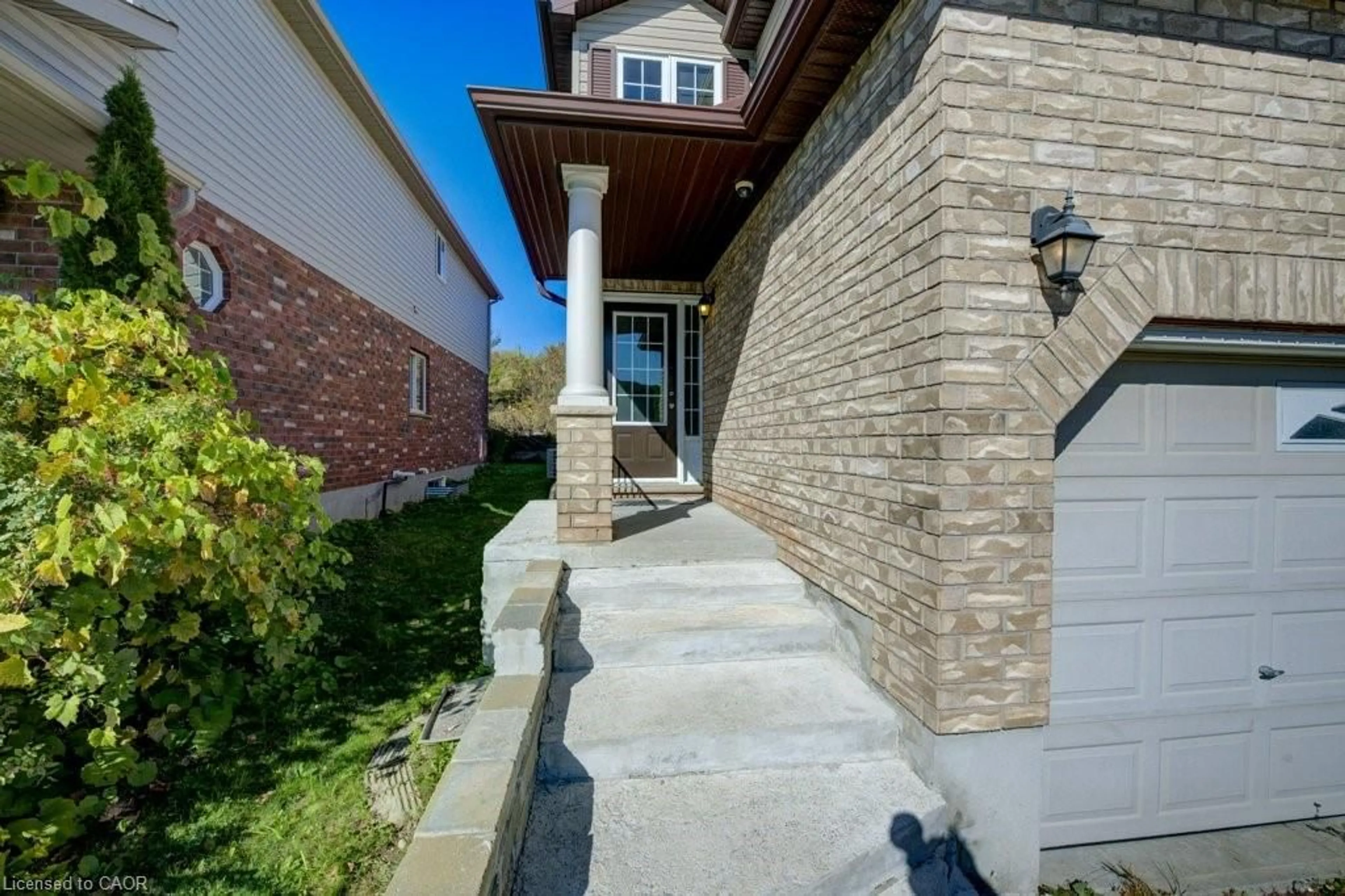 Home with brick exterior material, street for 404 Tealby Cres, Waterloo Ontario N2J 4Y8