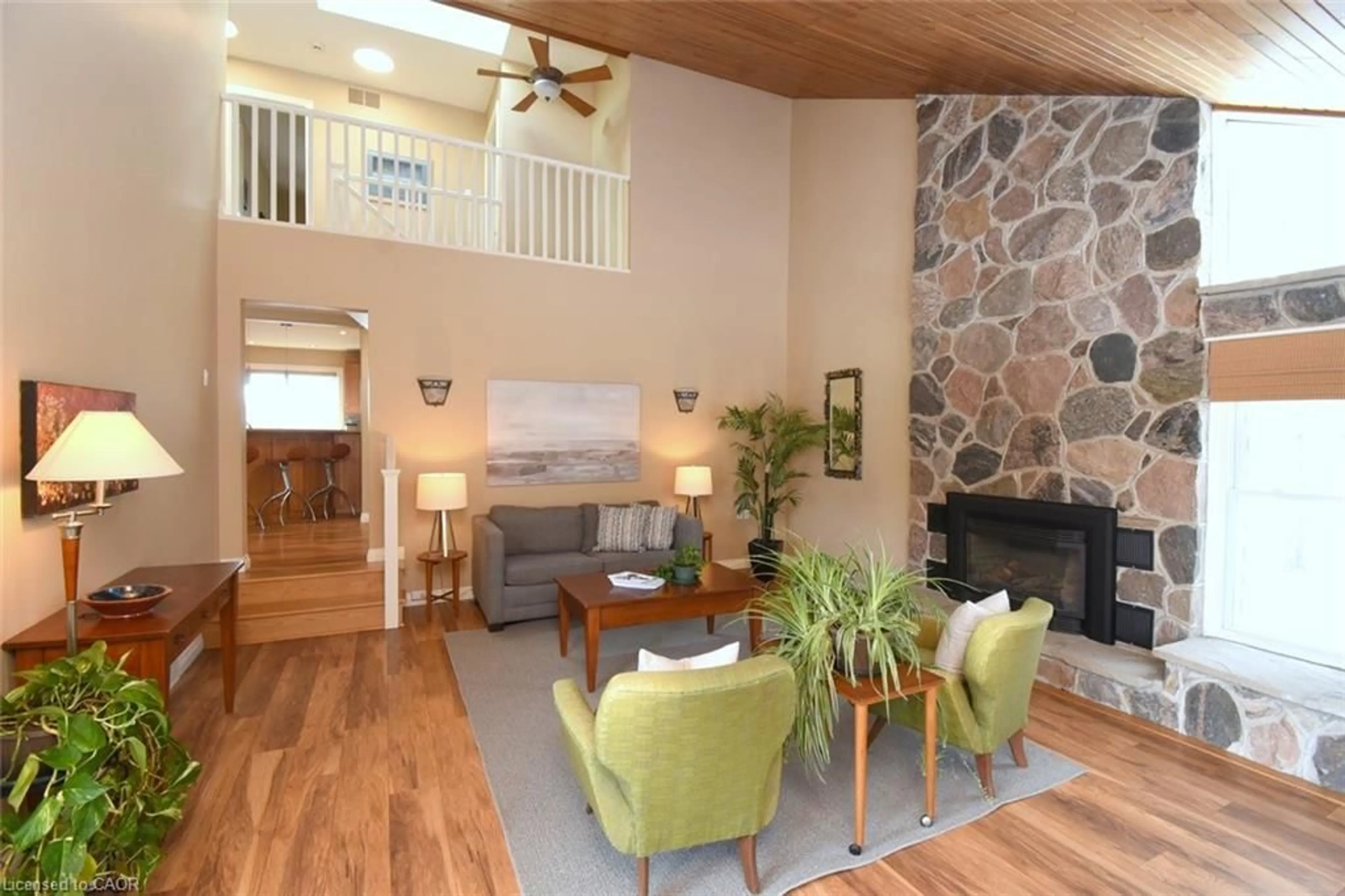 Living room with furniture, wood/laminate floor for 2952 Powerline Rd, Ancaster Ontario L0R 1T0