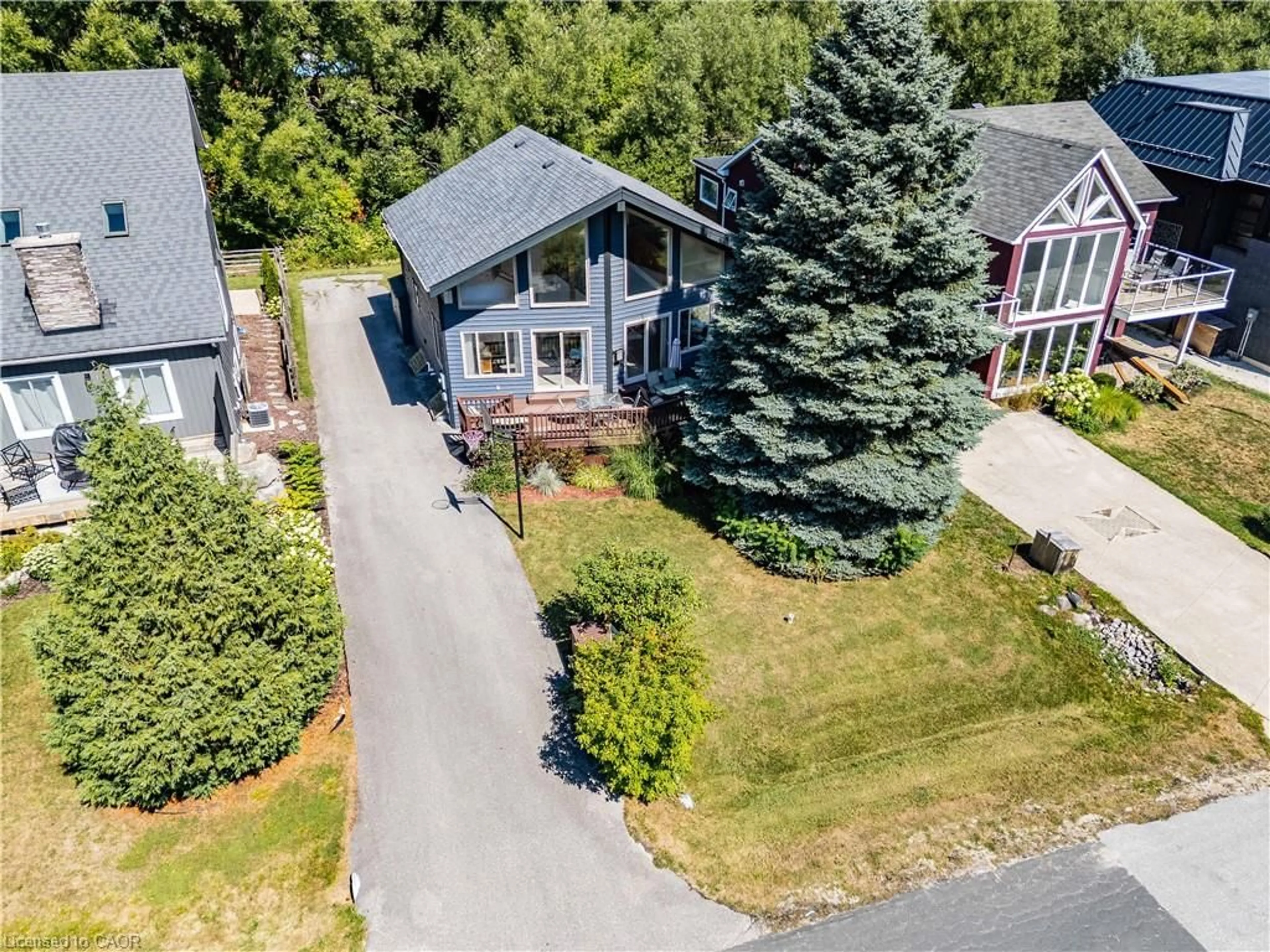 A pic from outside/outdoor area/front of a property/back of a property/a pic from drone, street for 115 Pioneer Lane, The Blue Mountains Ontario L9Y 0M6