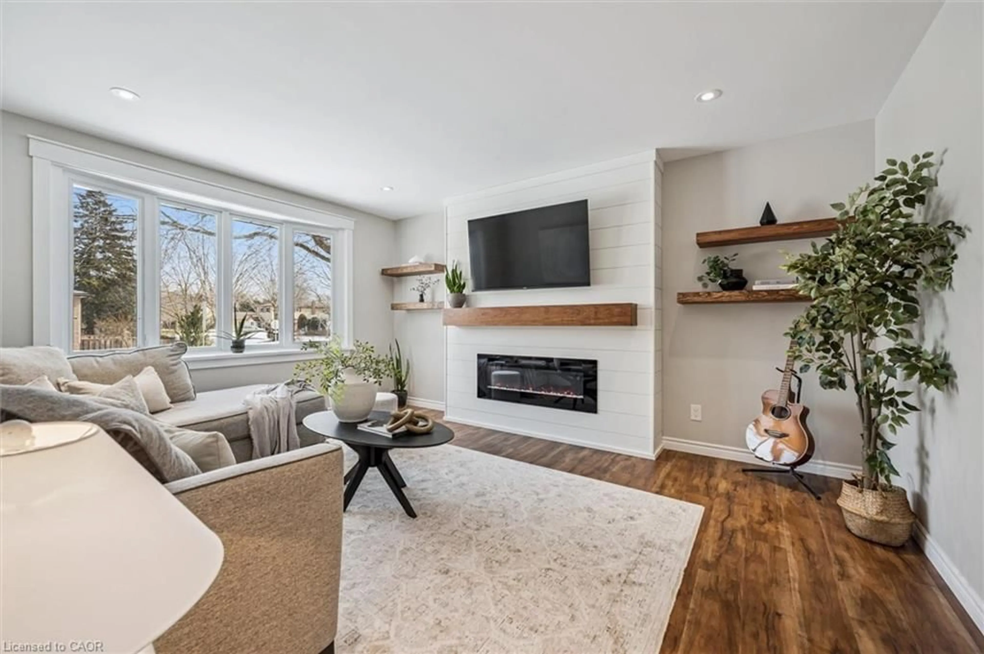 Living room with furniture, wood/laminate floor for 204 Irvine St, Elora Ontario N0B 1S0