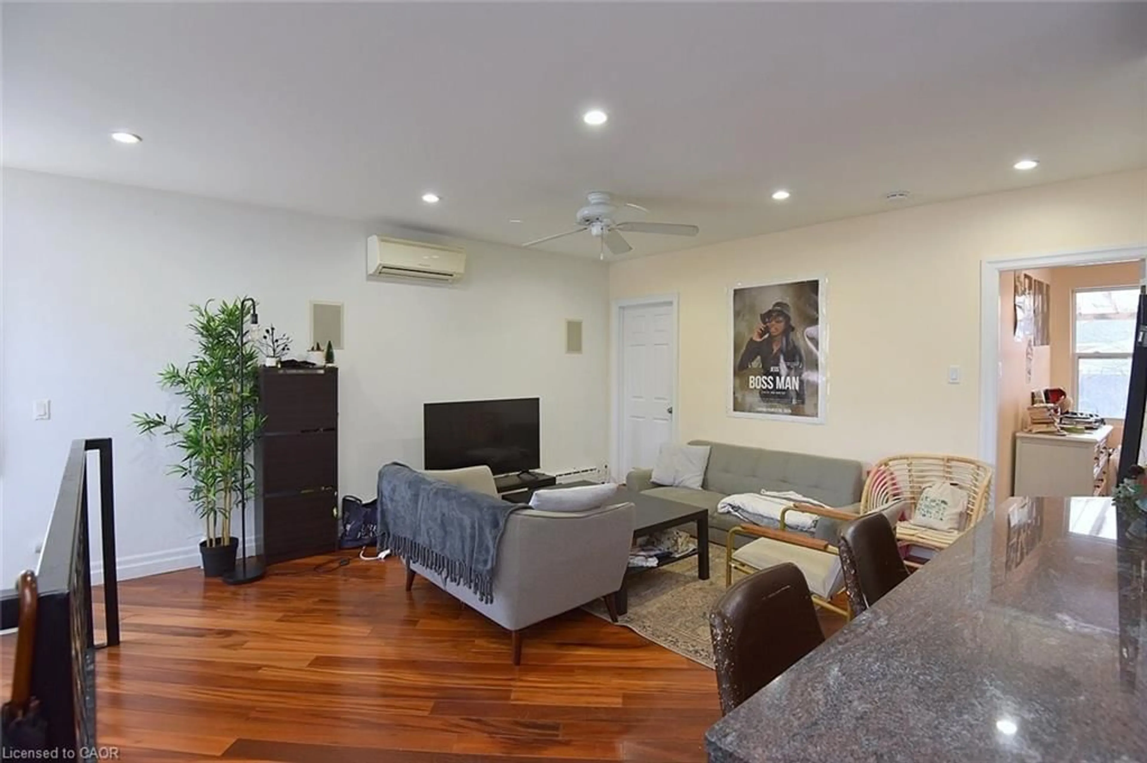 Living room with furniture, wood/laminate floor for 166 Haddon Ave, Hamilton Ontario L8S 1Y1