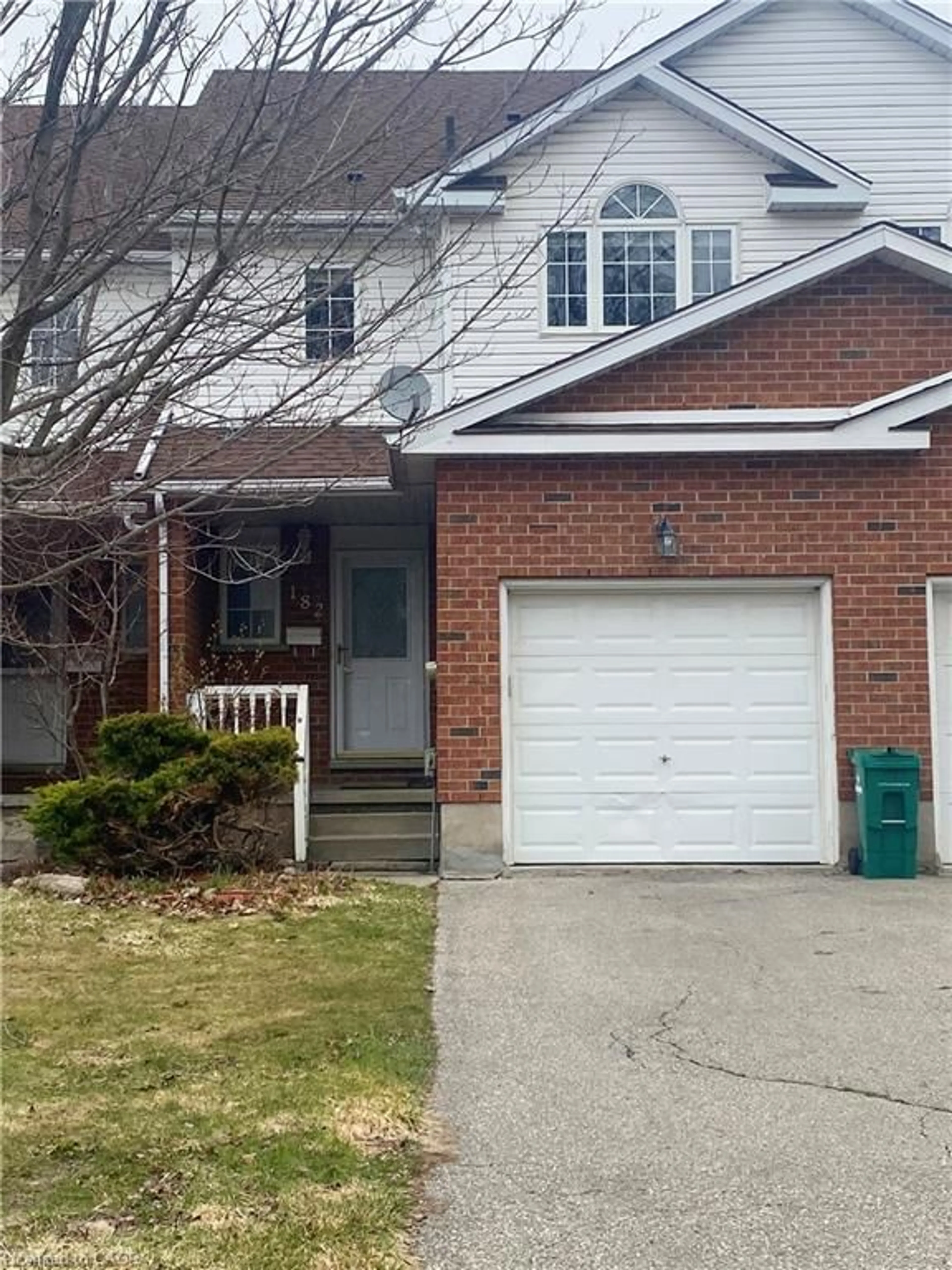 Home with brick exterior material, street for 182 Kingswood Dr, Kitchener Ontario N2E 1S9