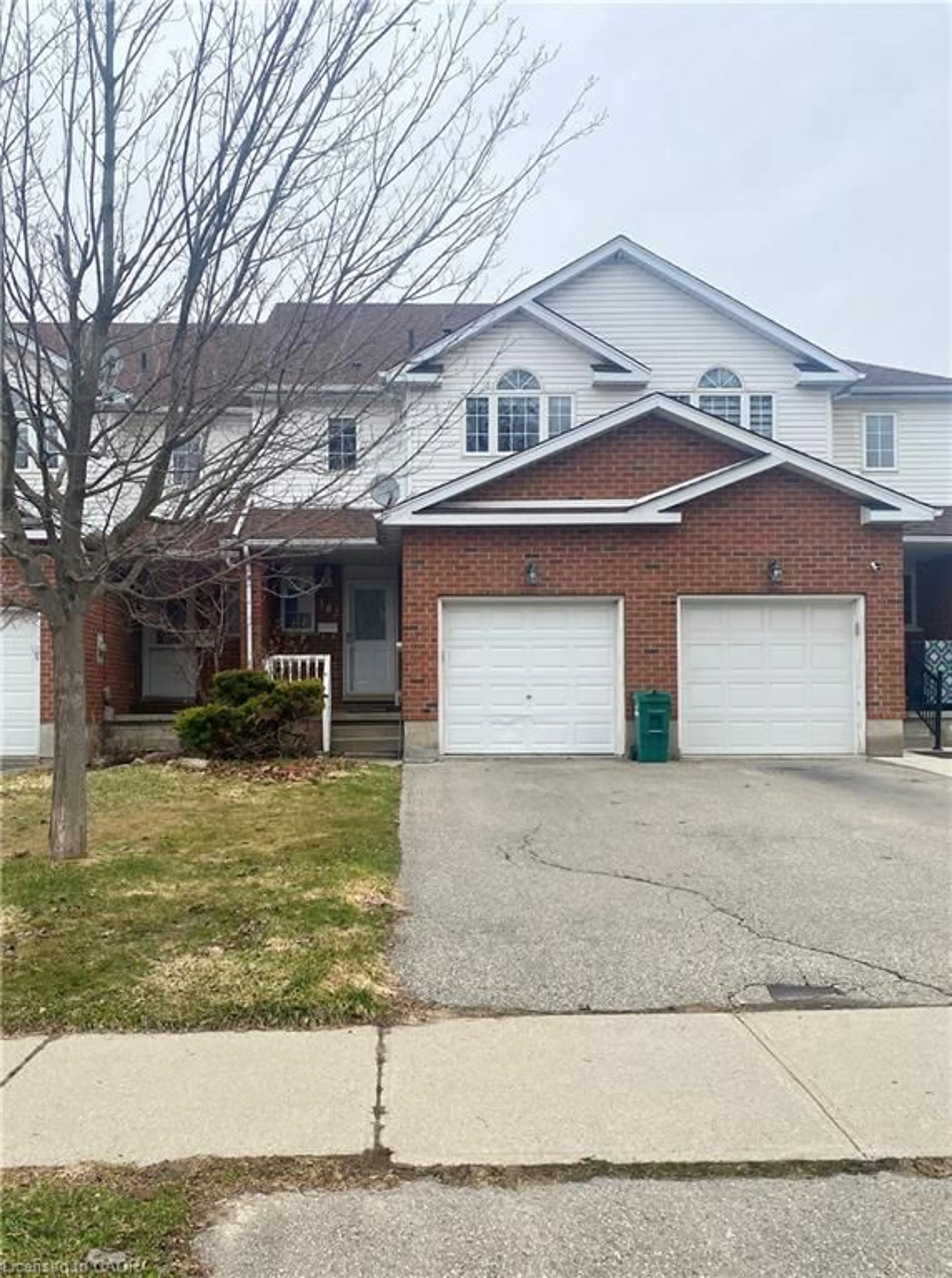 Home with brick exterior material, street for 182 Kingswood Dr, Kitchener Ontario N2E 1S9