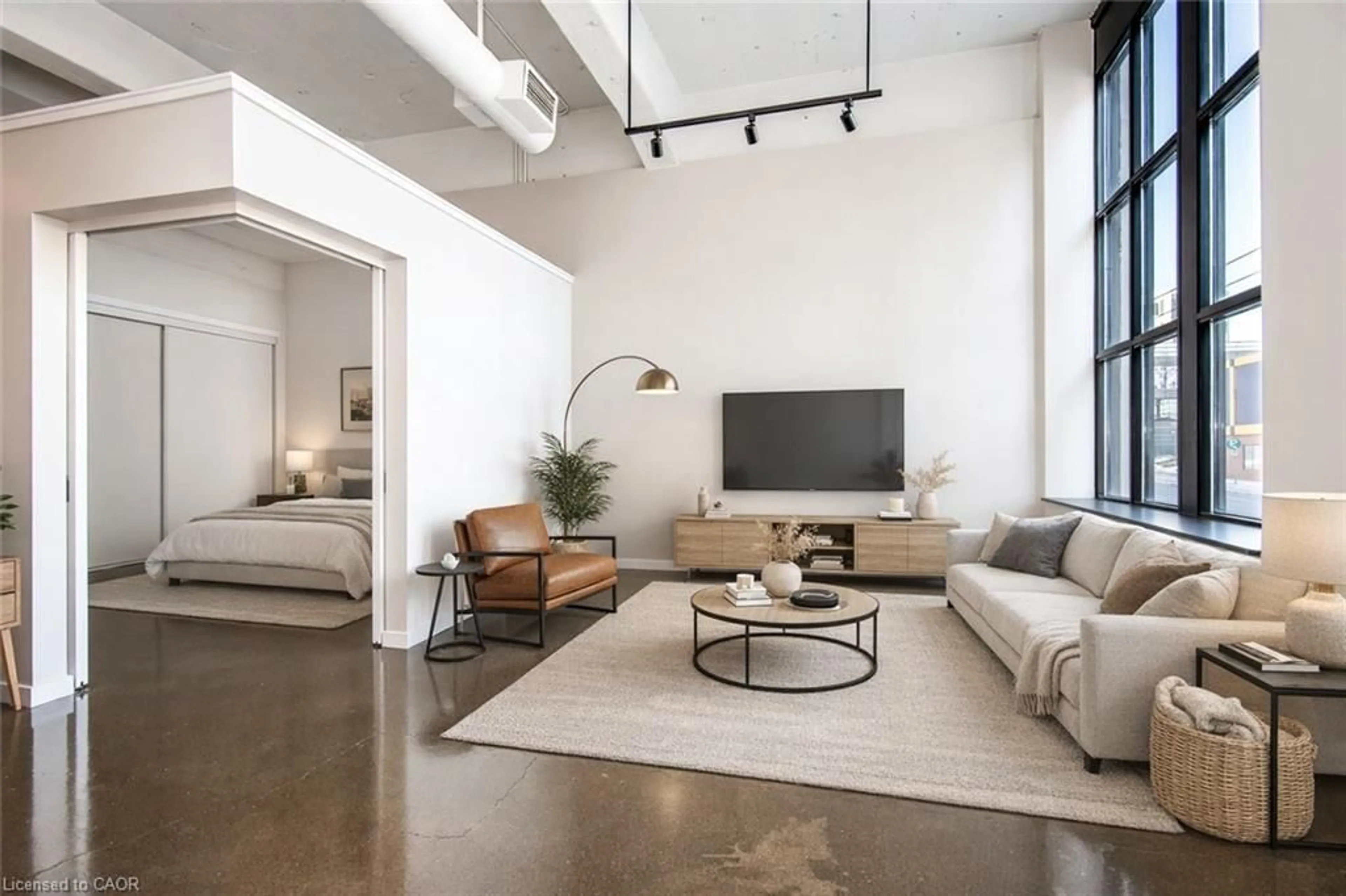 Living room with furniture, cement floor for 410 King St #104, Kitchener Ontario N2G 1C3