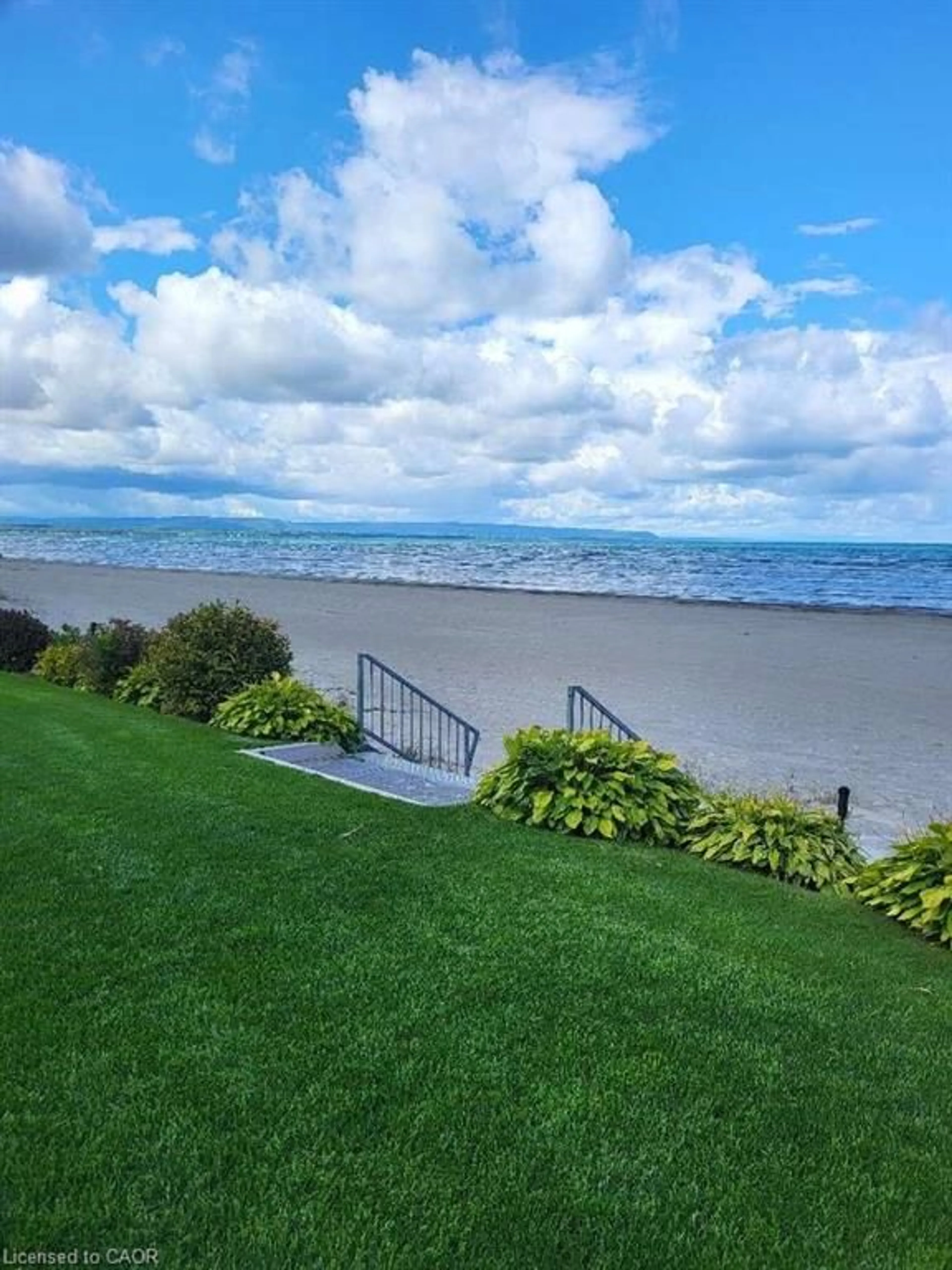 A pic from outside/outdoor area/front of a property/back of a property/a pic from drone, water/lake/river/ocean view for 15 28th St #10, Wasaga Beach Ontario L9Z 2E3