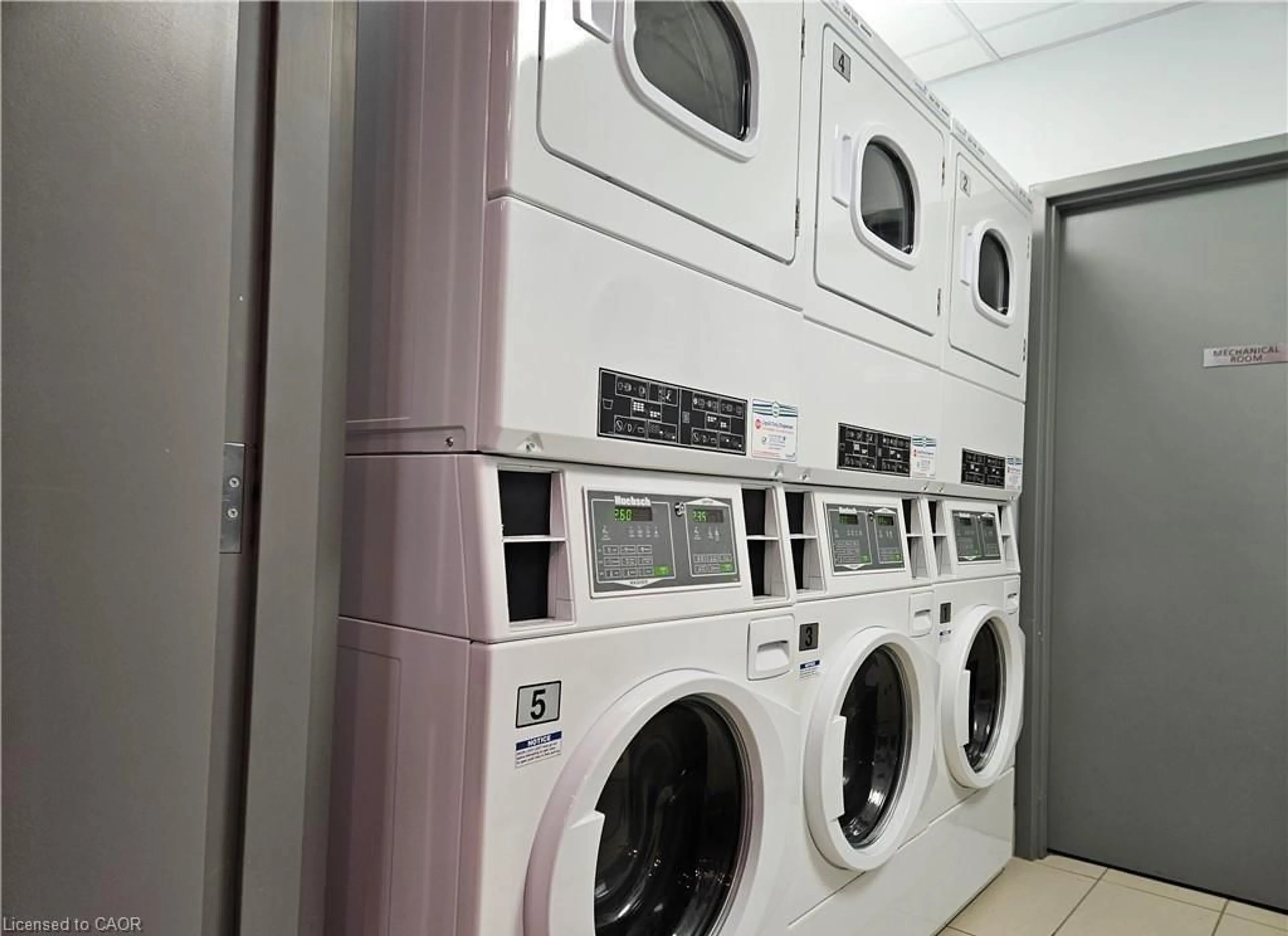 Kitchen with laundary machines, unknown for 77 Leland St #119, Hamilton Ontario L8S 3A1