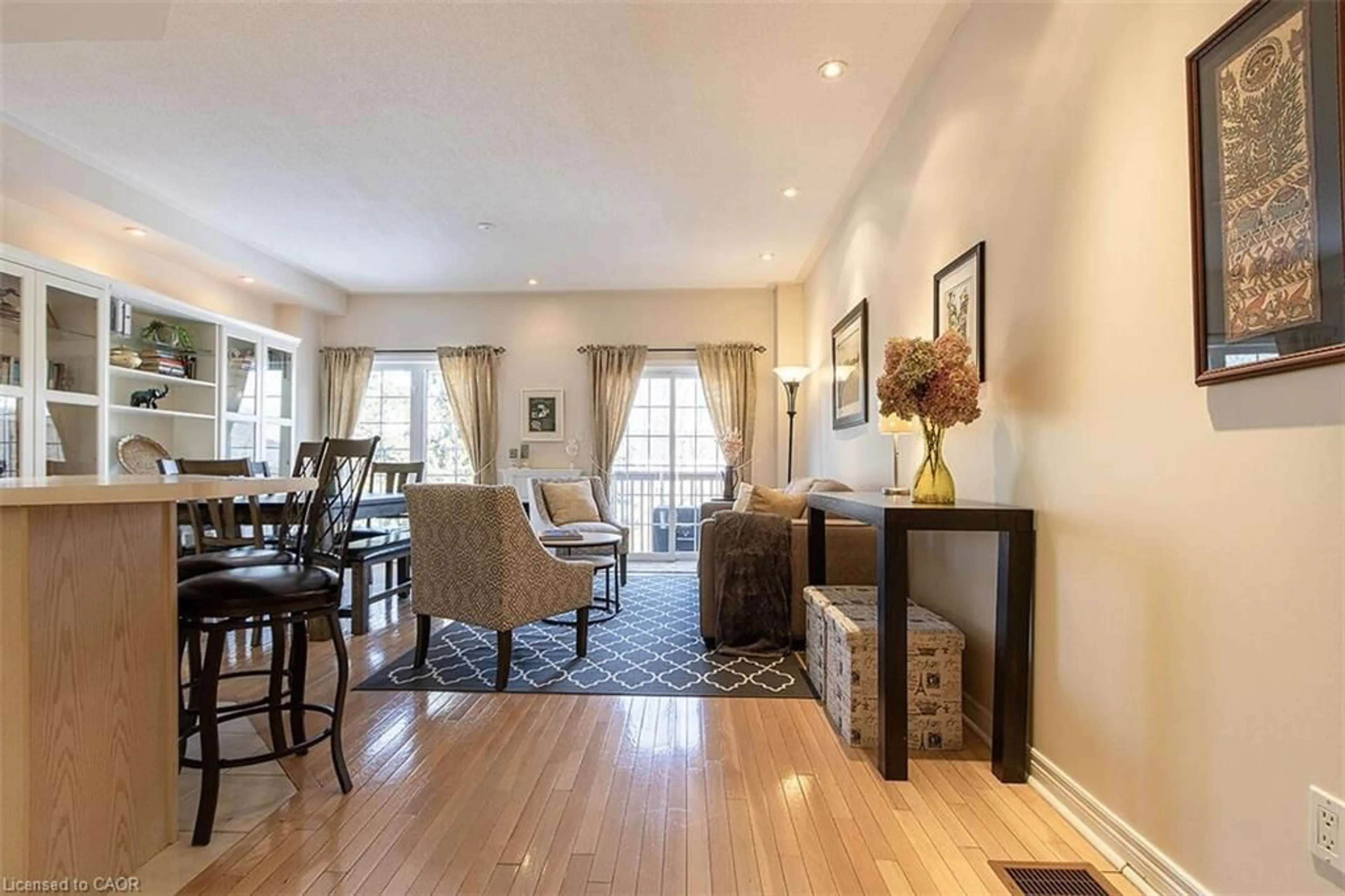 Living room with furniture, wood/laminate floor for 100 Beddoe Dr #98, Hamilton Ontario L8P 4Z2