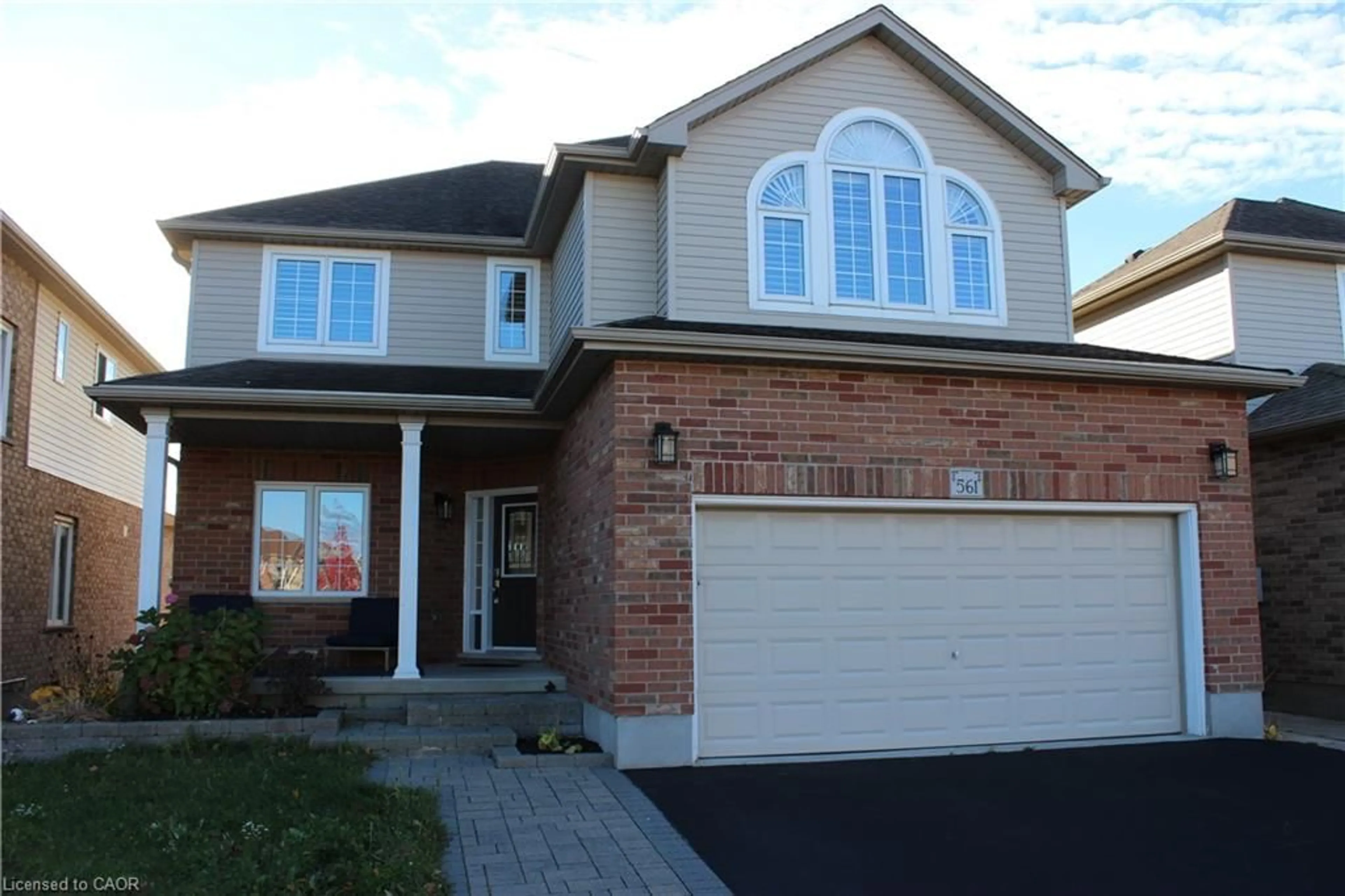 Home with brick exterior material, street for 561 Thomas Slee Dr, Kitchener Ontario N2P 2Y7