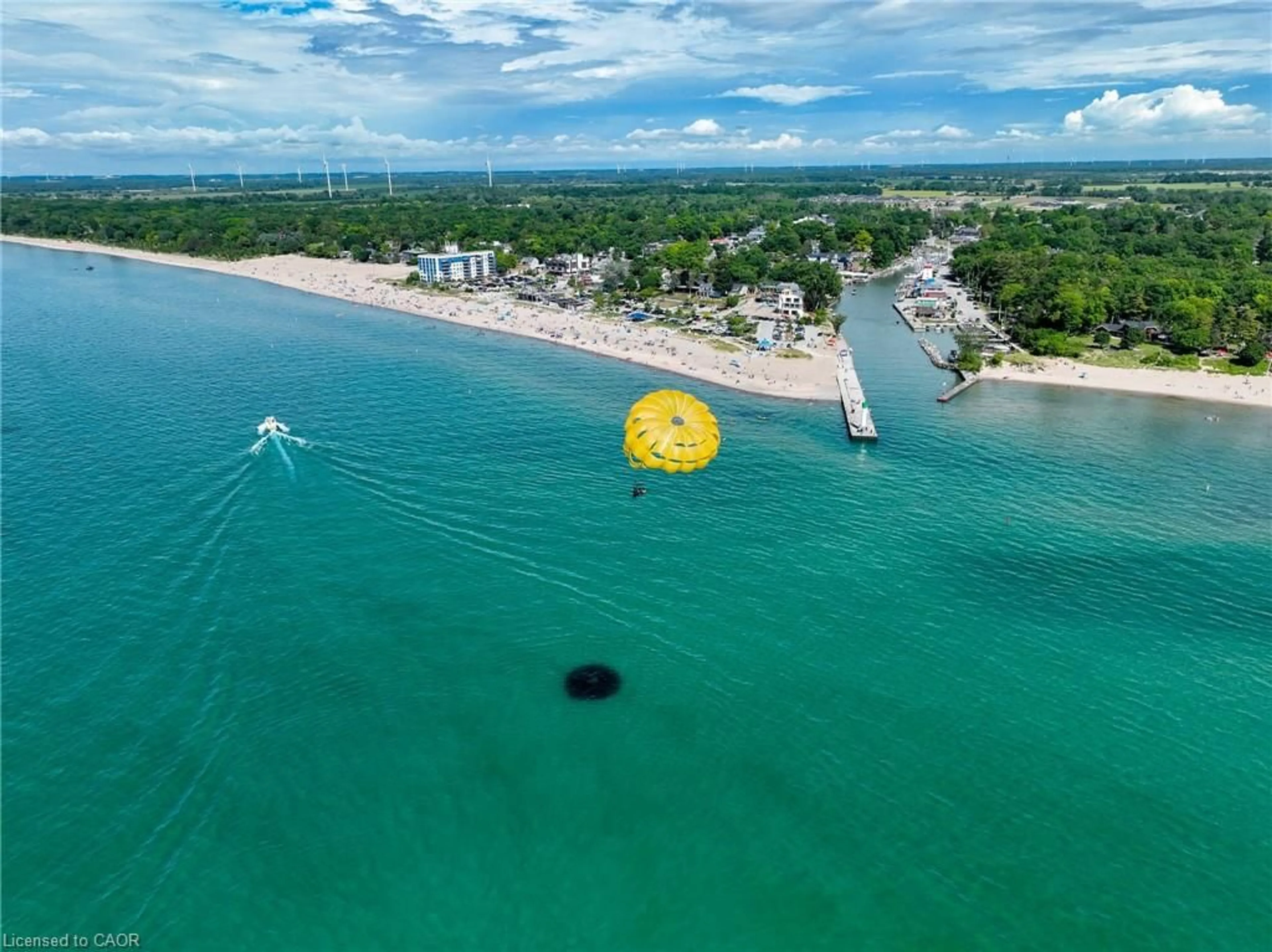 A pic from outside/outdoor area/front of a property/back of a property/a pic from drone, water/lake/river/ocean view for 55 Centre St, Grand Bend Ontario N0M 1T0