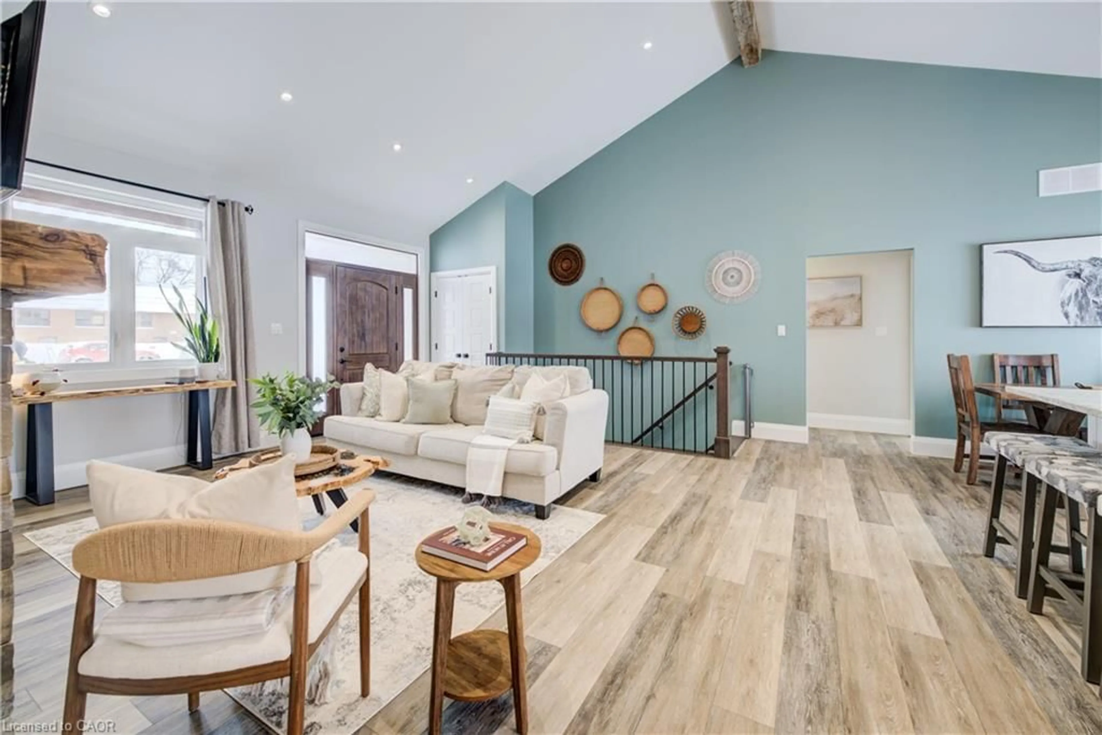 Living room with furniture, wood/laminate floor for 21 Paxton St, Holyrood Ontario N0G 2B0