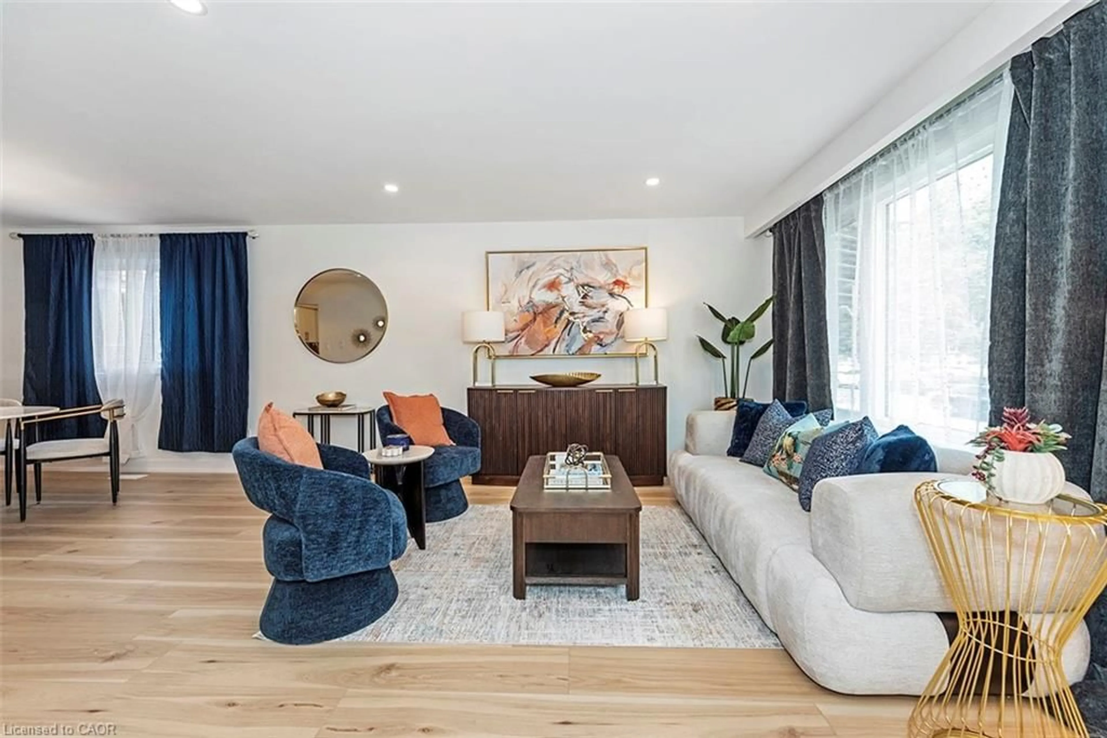 Living room with furniture, wood/laminate floor for 56 & 58 Delawana Dr, Hamilton Ontario L8E 1G4