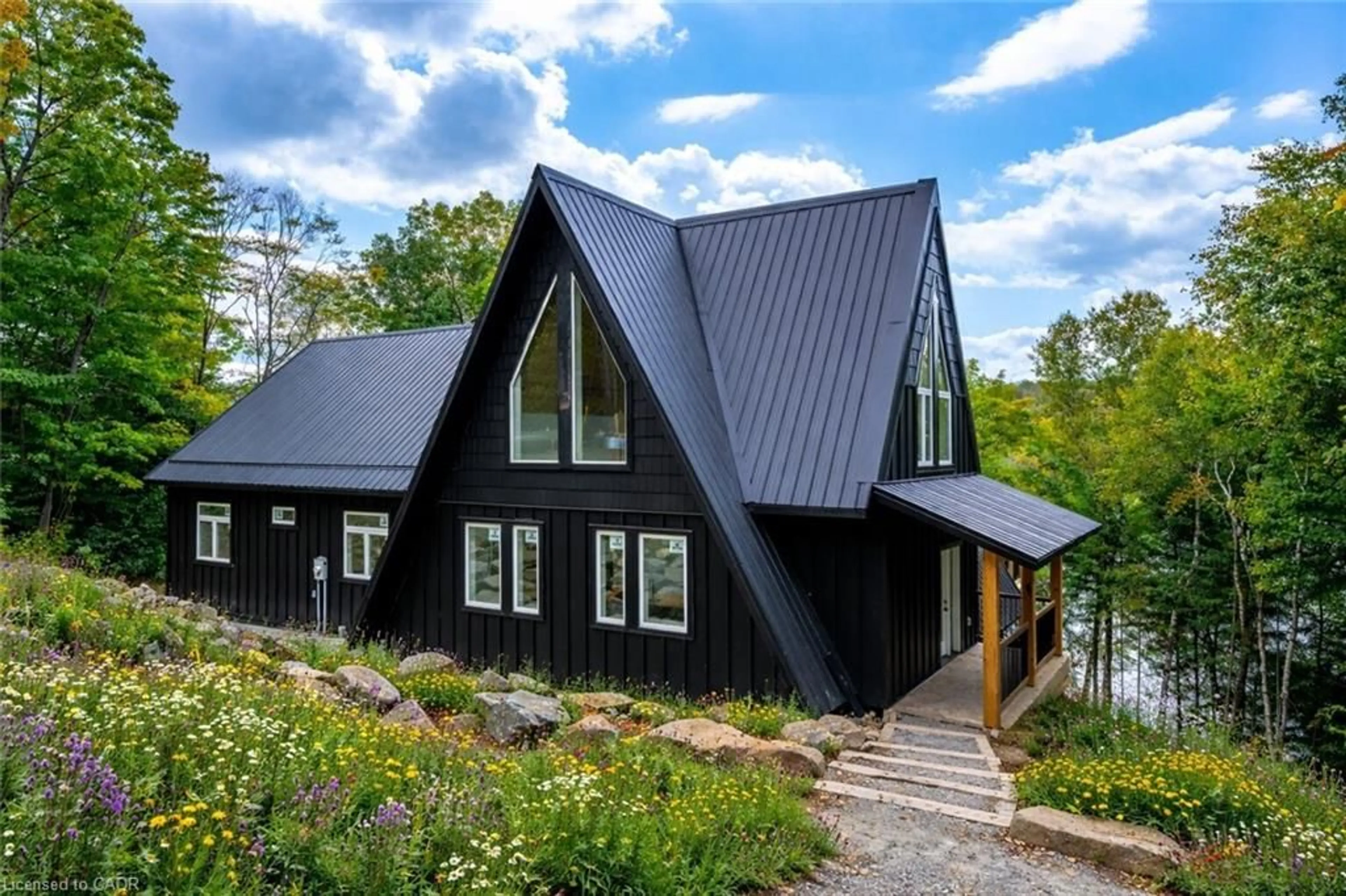 Home with vinyl exterior material, mountain view for 1295 Wenona Lake Rd, Haliburton Ontario K0M 1S0