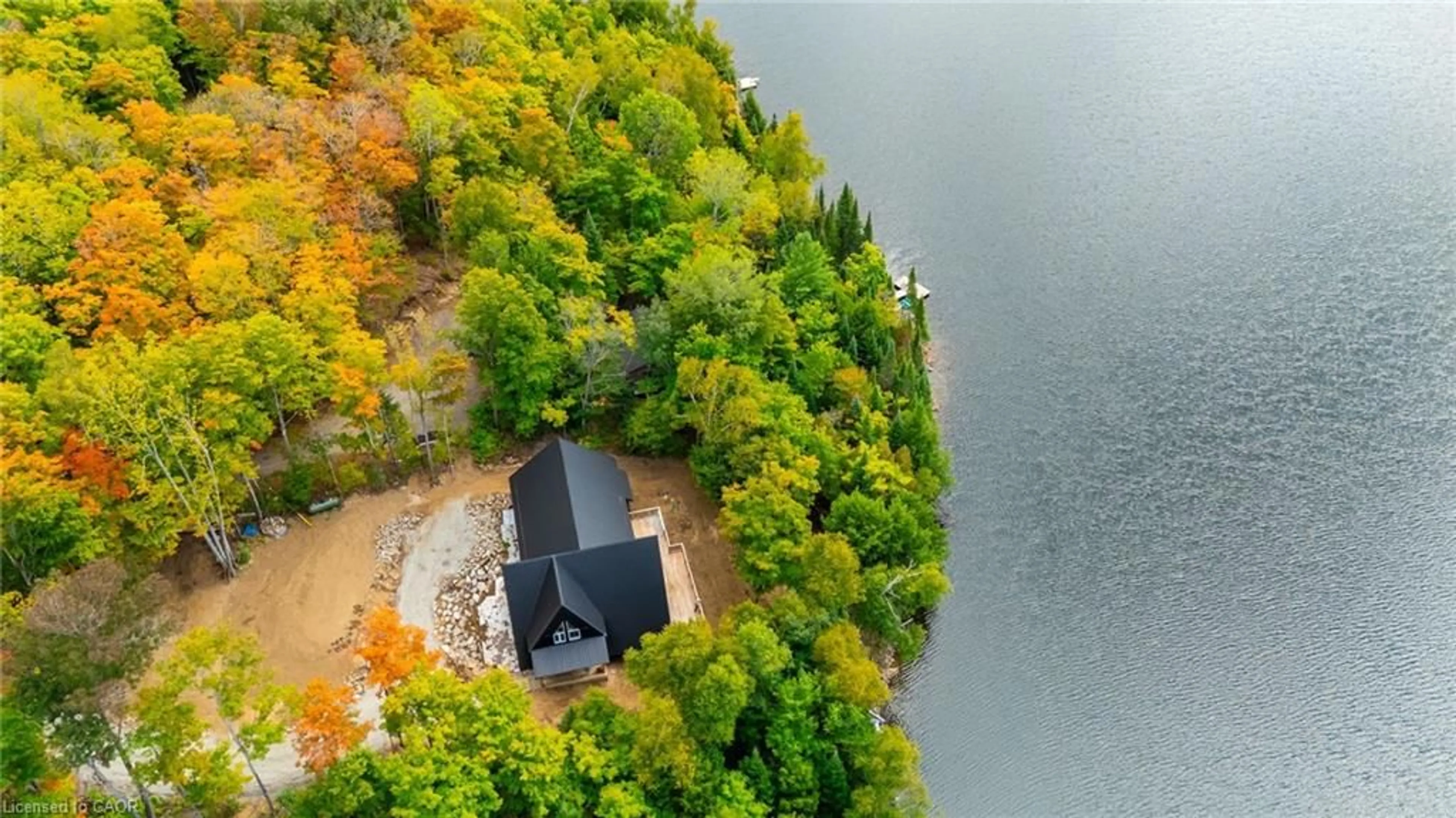 A pic from outside/outdoor area/front of a property/back of a property/a pic from drone, water/lake/river/ocean view for 1295 Wenona Lake Rd, Haliburton Ontario K0M 1S0