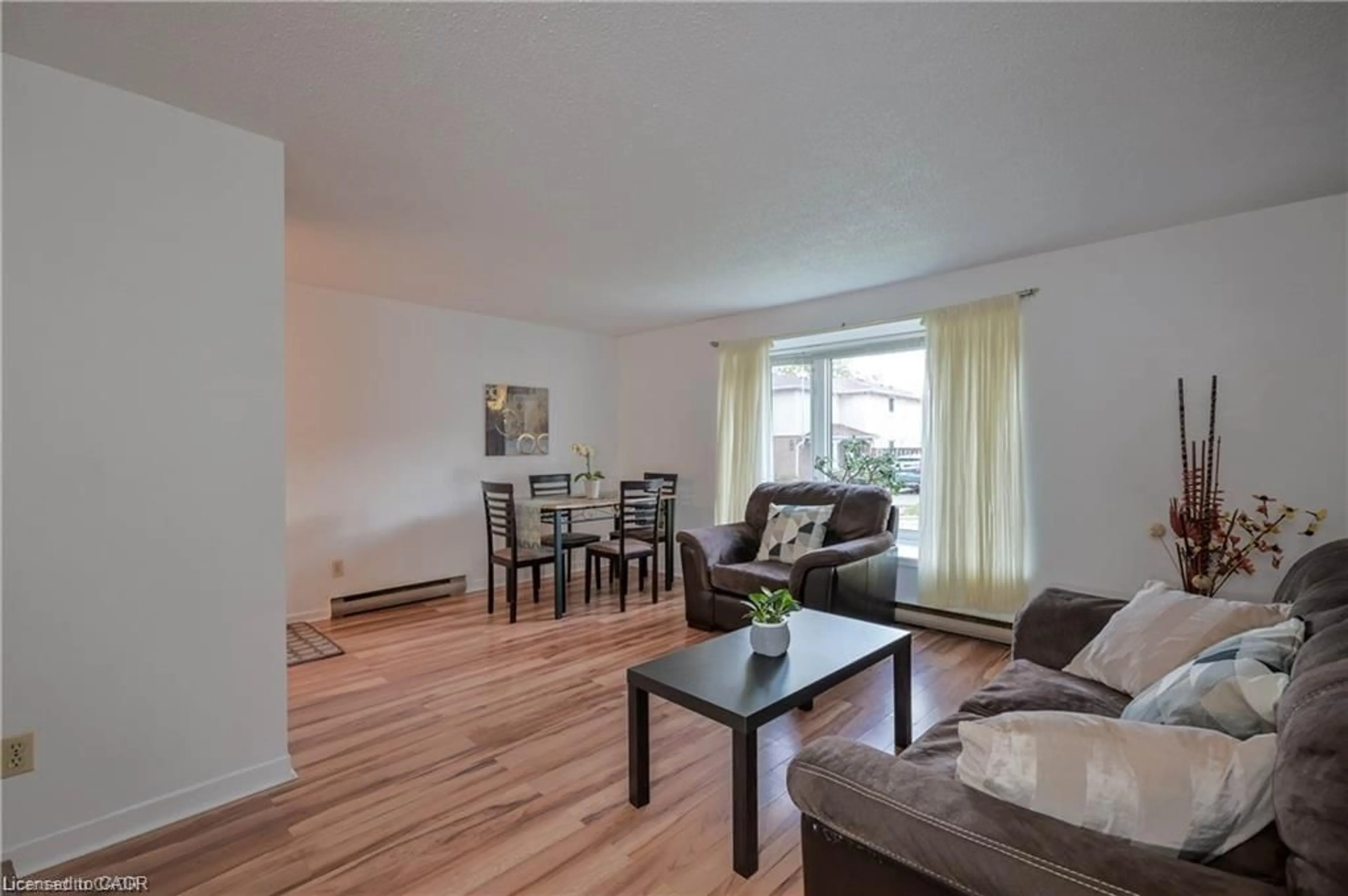 Living room with furniture, wood/laminate floor for 169 Elm Ridge Dr #25, Kitchener Ontario N2N 1L7