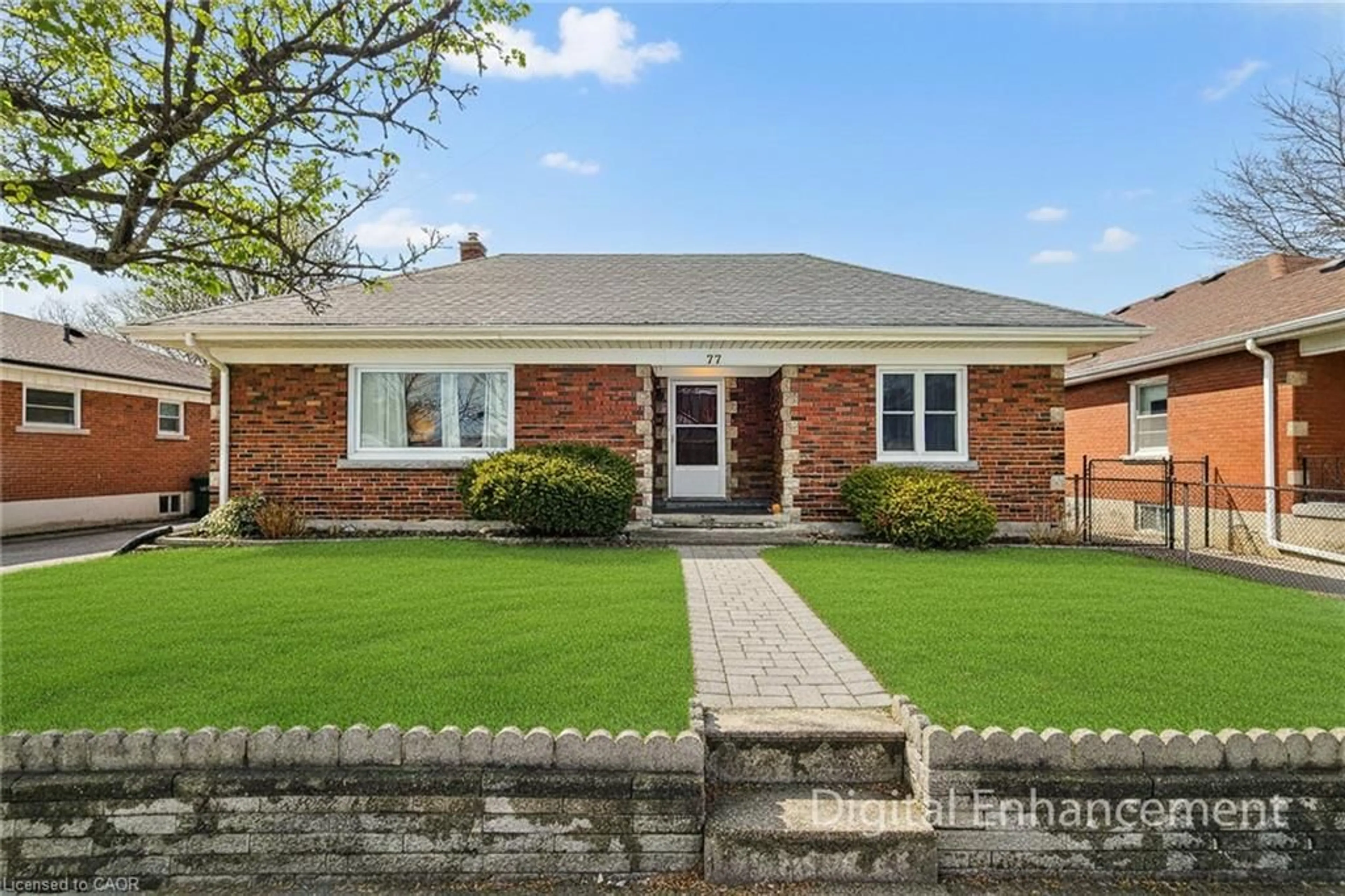 Home with brick exterior material, street for 77 Tenth Ave, Brantford Ontario N3S 1G5