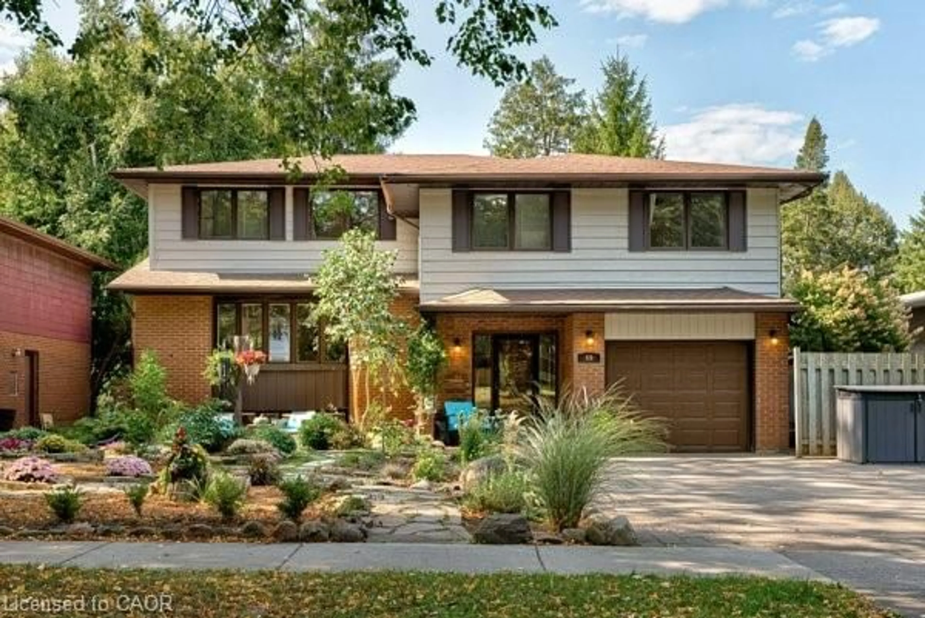 Home with brick exterior material, street for 69 Longwood Dr, Waterloo Ontario N2L 4B6