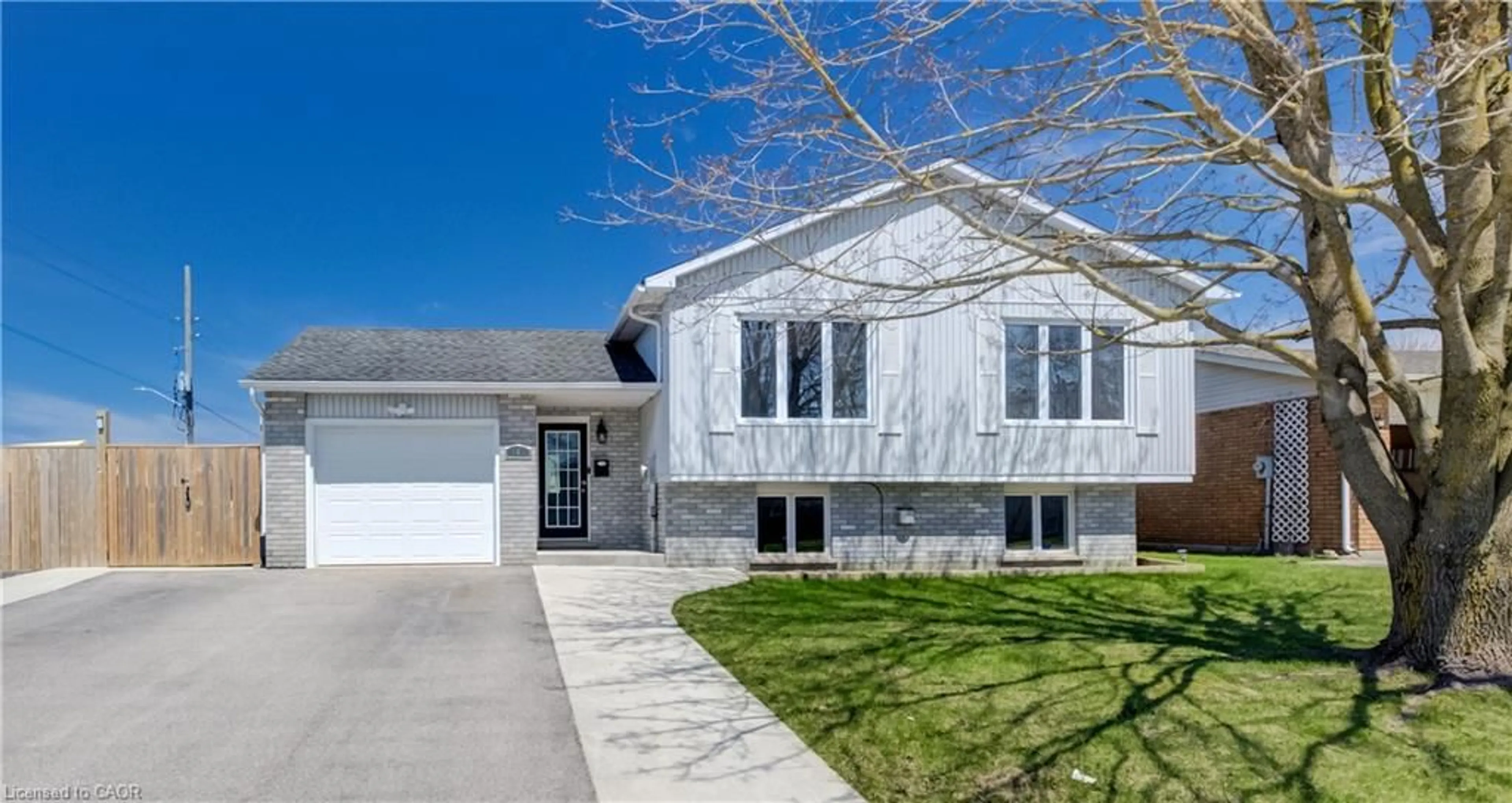 Home with vinyl exterior material, street for 103 Melissa Cres, Mount Forest Ontario N0G 2L3