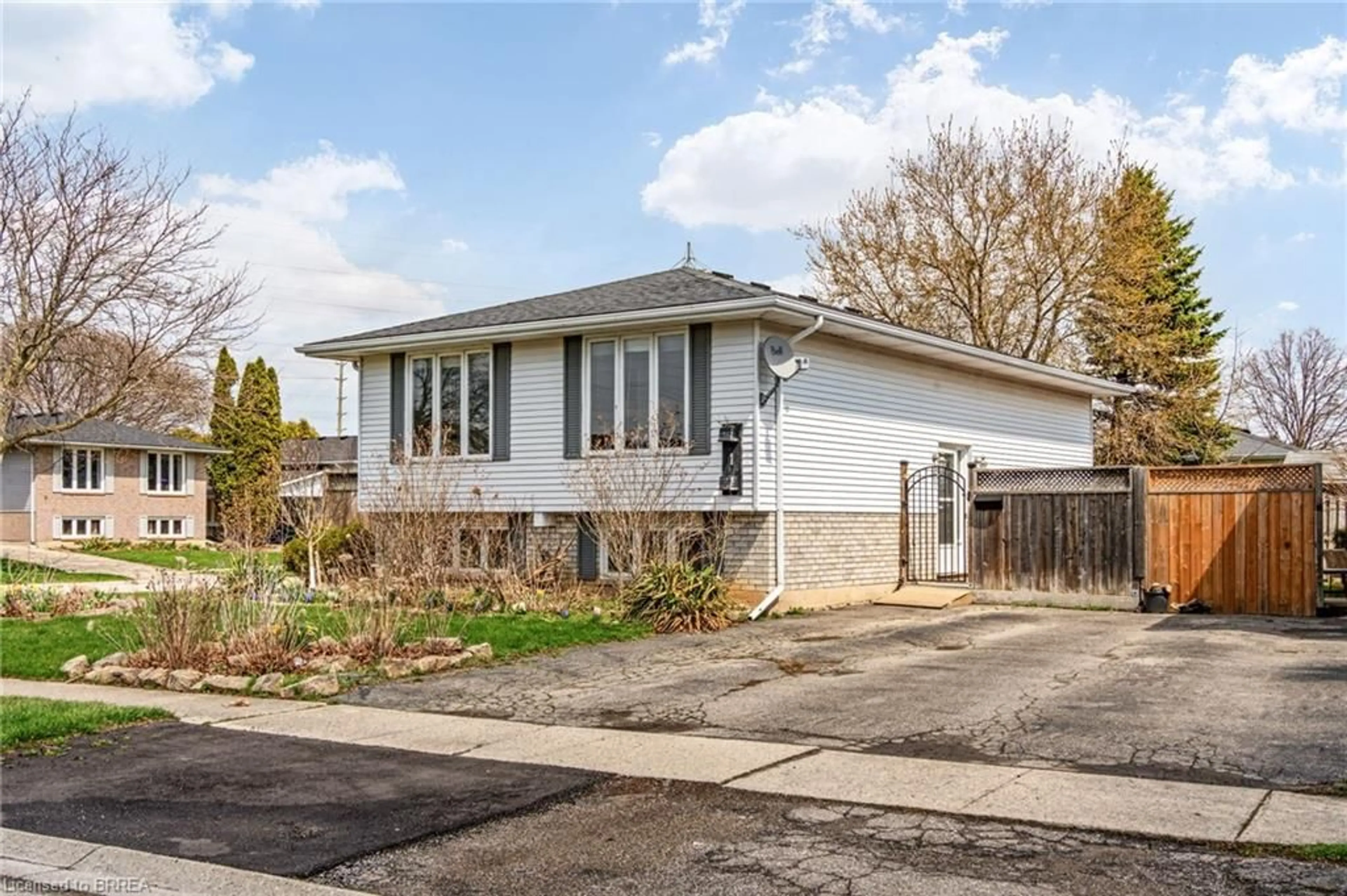 Home with vinyl exterior material, street for 1 Osijek Cres, Brantford Ontario N3P 1Z3