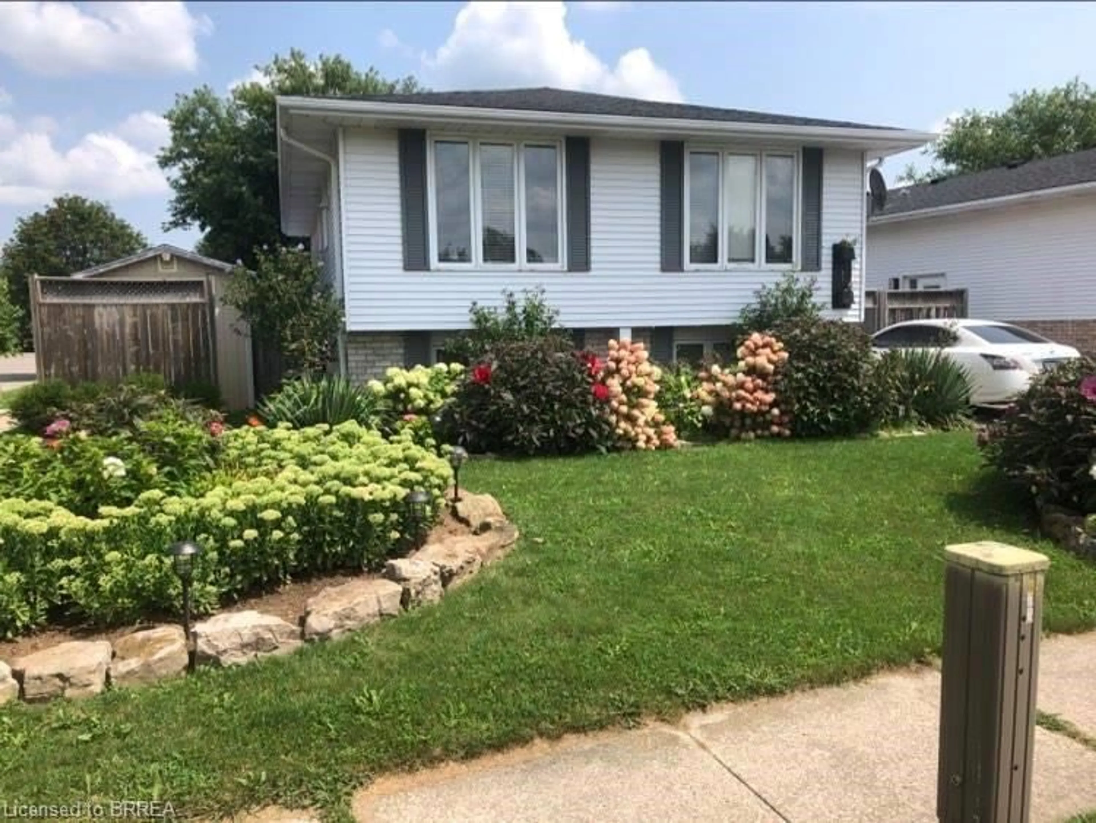 Home with vinyl exterior material, street for 1 Osijek Cres, Brantford Ontario N3P 1Z3