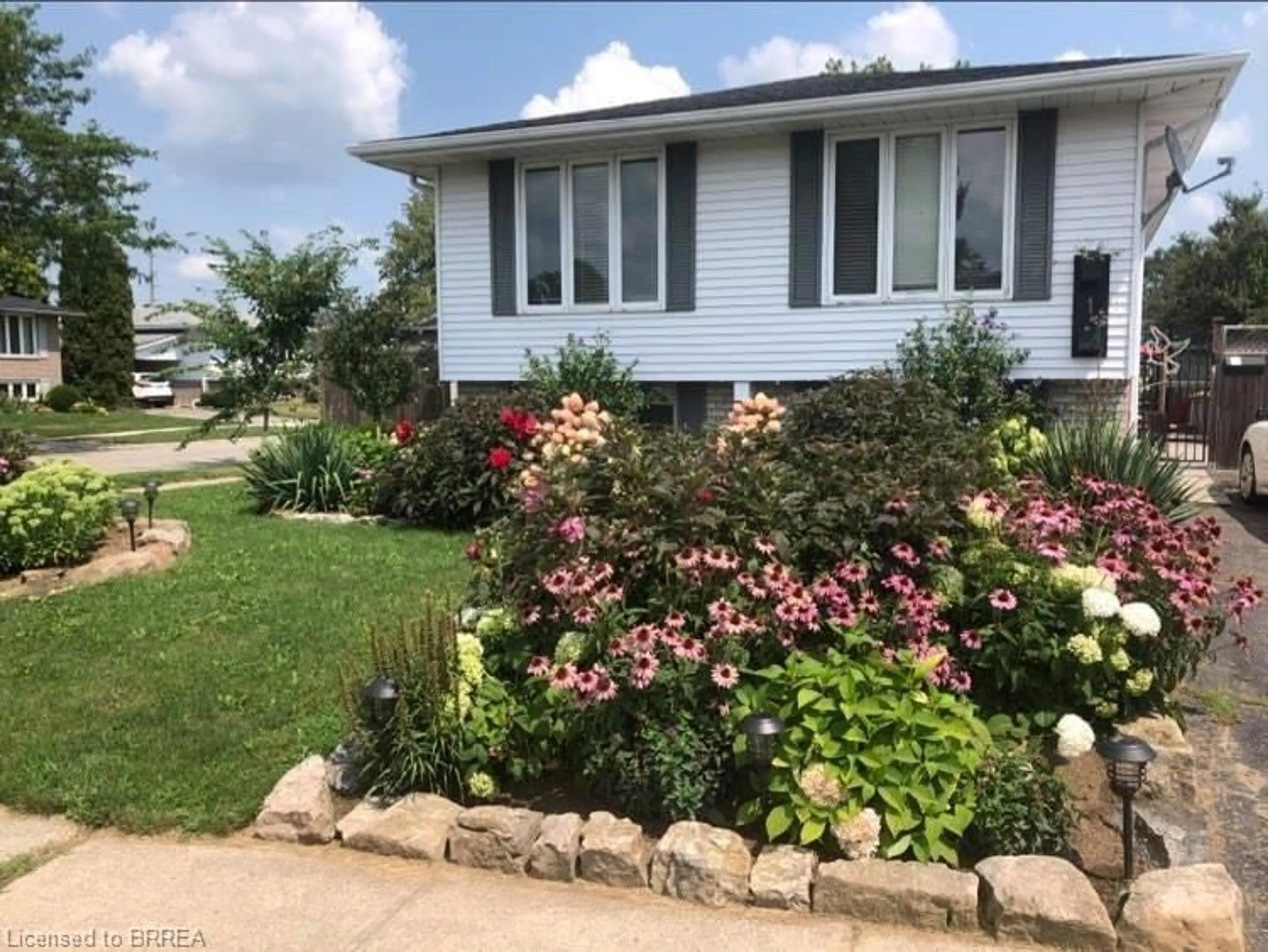 Home with vinyl exterior material, street for 1 Osijek Cres, Brantford Ontario N3P 1Z3